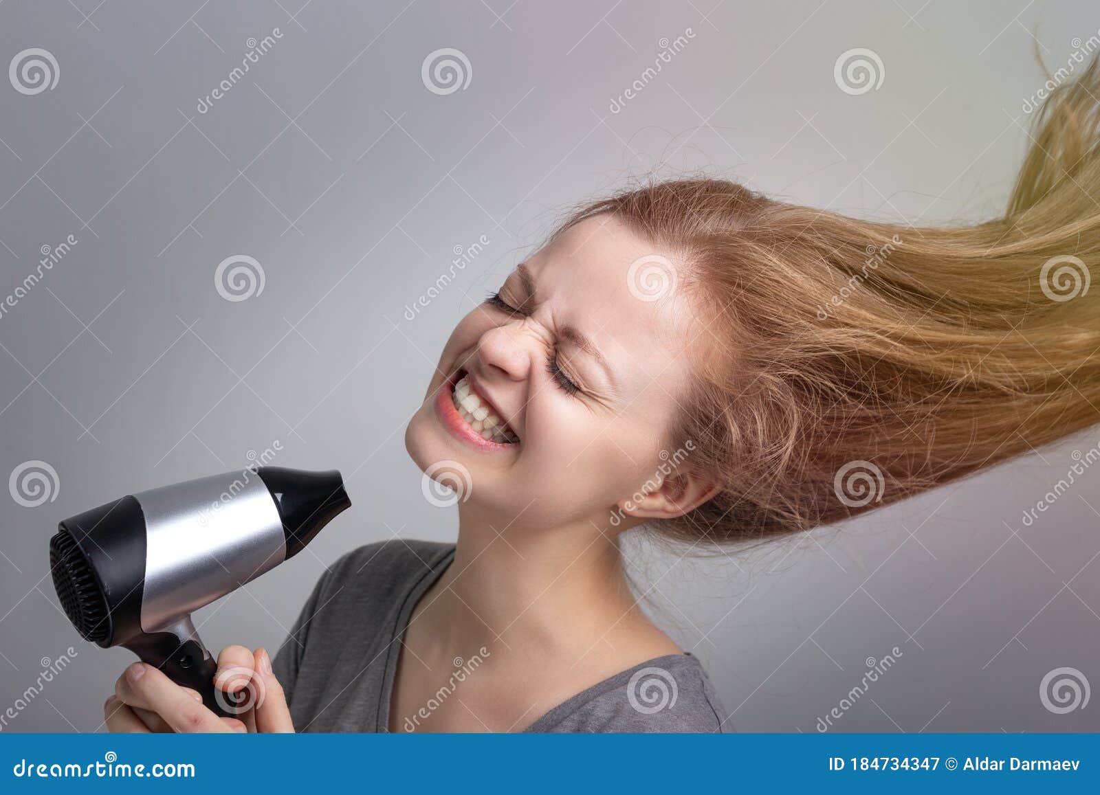 Young Caucasian Woman Girl is Blow Drying Her Long Hair Using Electric Hair Dryer with Happy Smiling Face Stock Image - Image of lady, happy: 184734347 Young Caucasian Woman Girl is Blow Drying Her Long Hair Using Electric Hair Dryer with Happy Smiling Face Stock Image - Image of lady, happy: 184734347