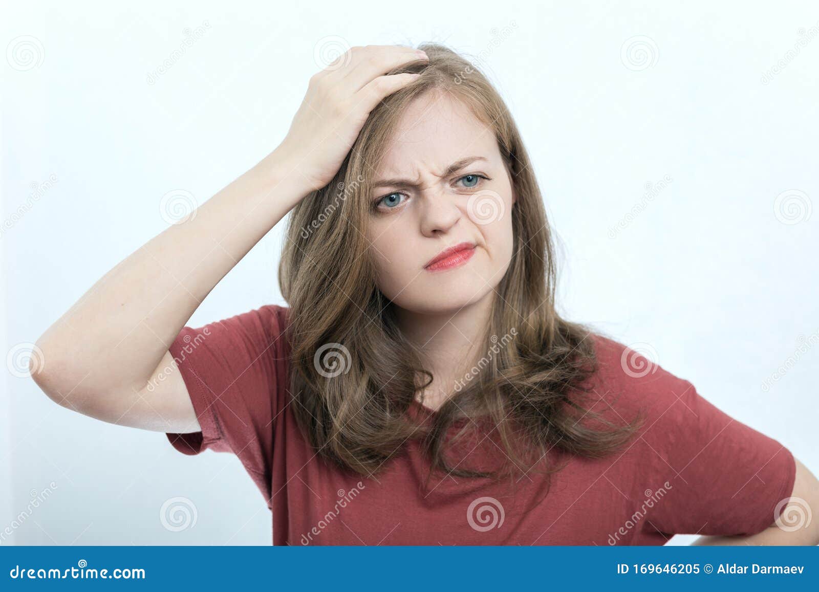 young caucasian woman girl with puzzled, confused expression, think, forgot or remember something