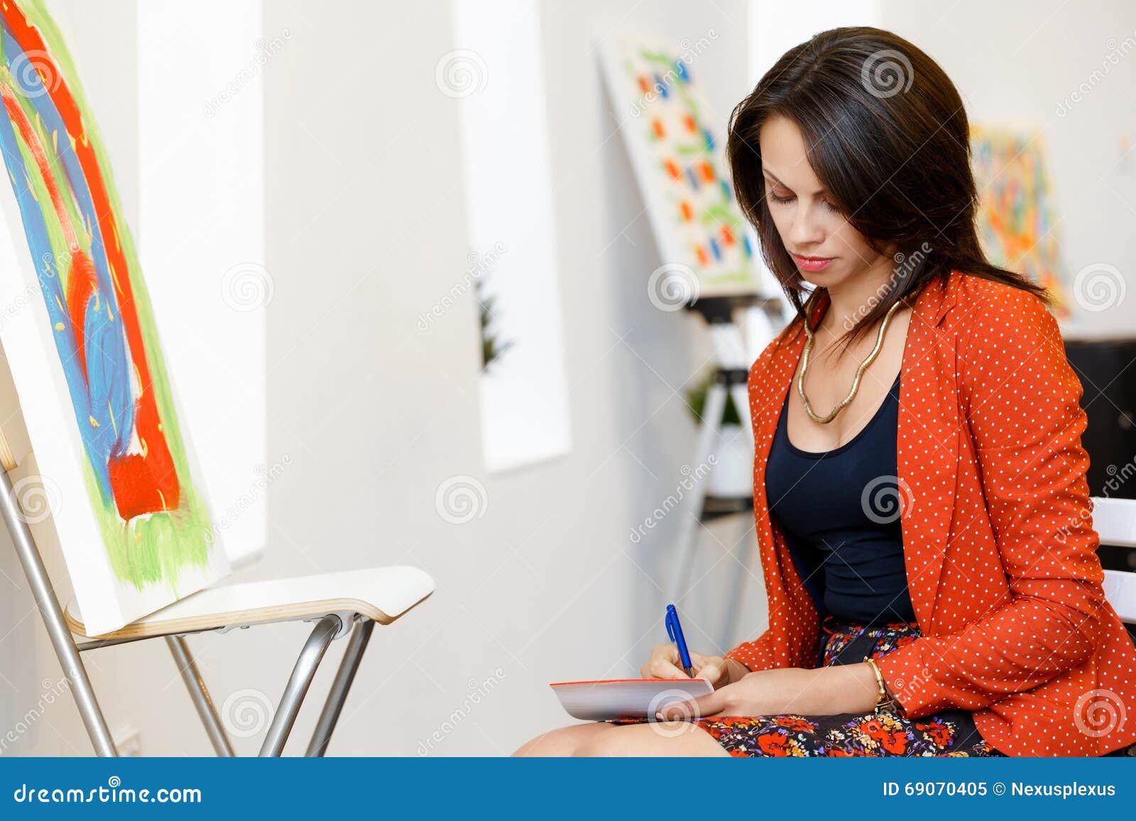 Young Caucasian Woman Standing in Art Gallery Front of Paintings Stock ...