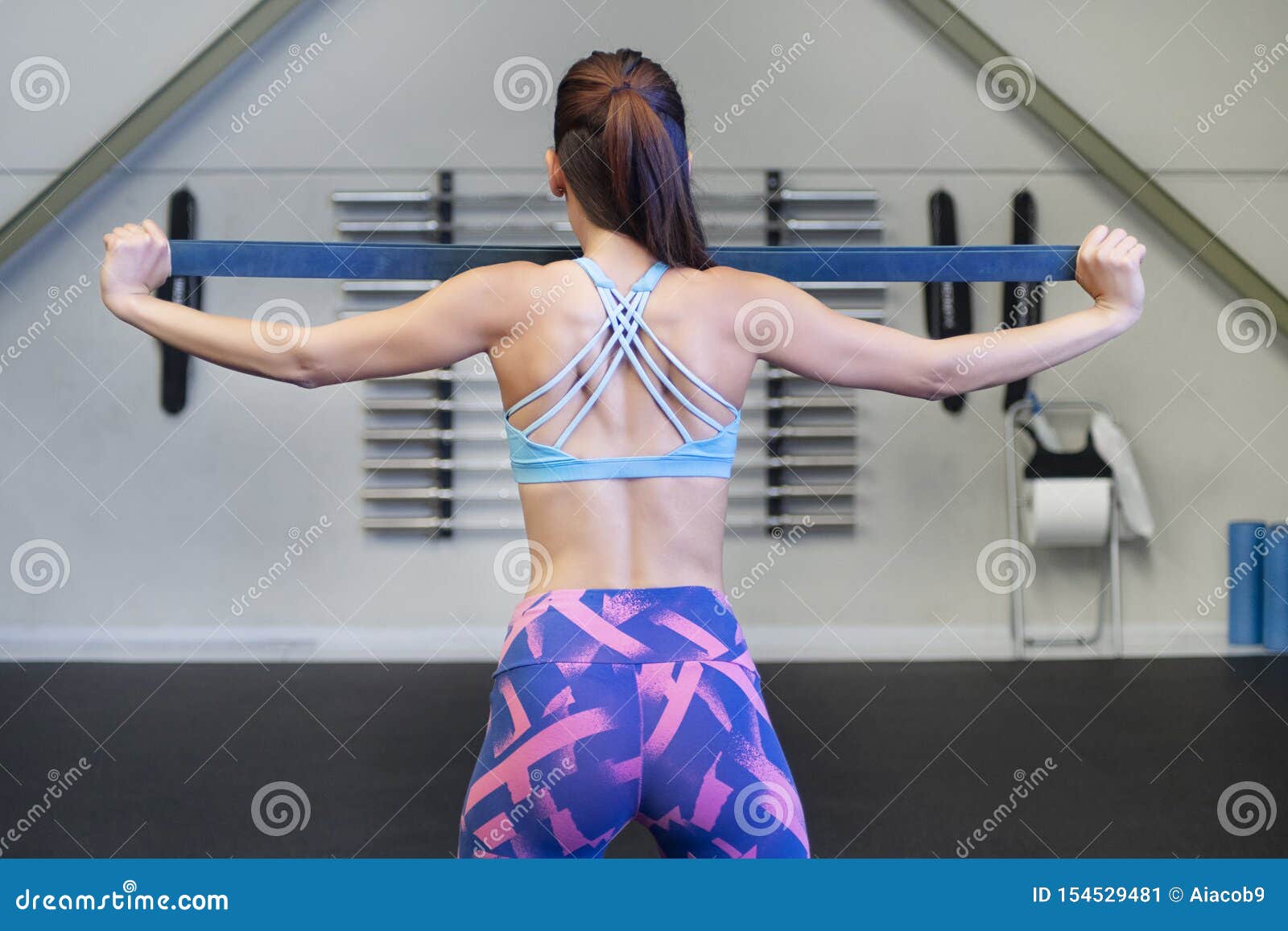 Young Caucasian Woman Using a Resistance Rubber Band To Tone Her Back Stock  Photo - Image of energy, endurance: 154529780