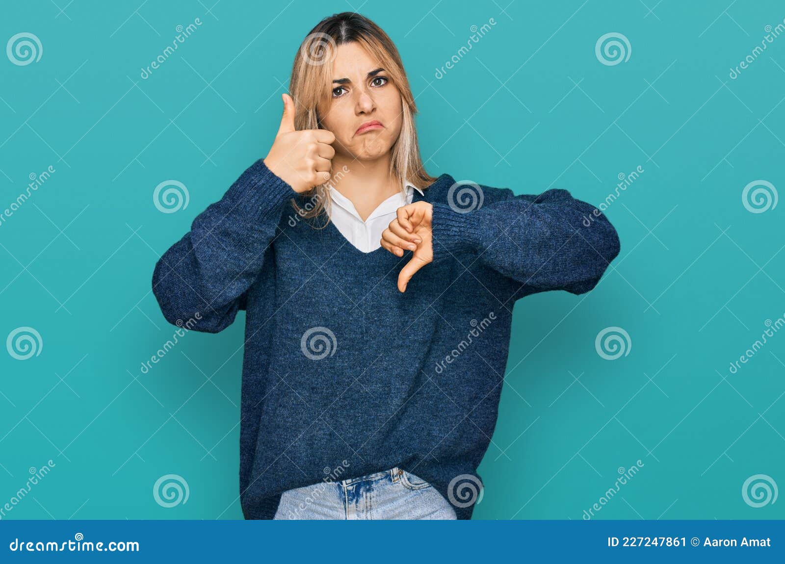 Young Caucasian Woman Wearing Casual Clothes Doing Thumbs Up and Down ...