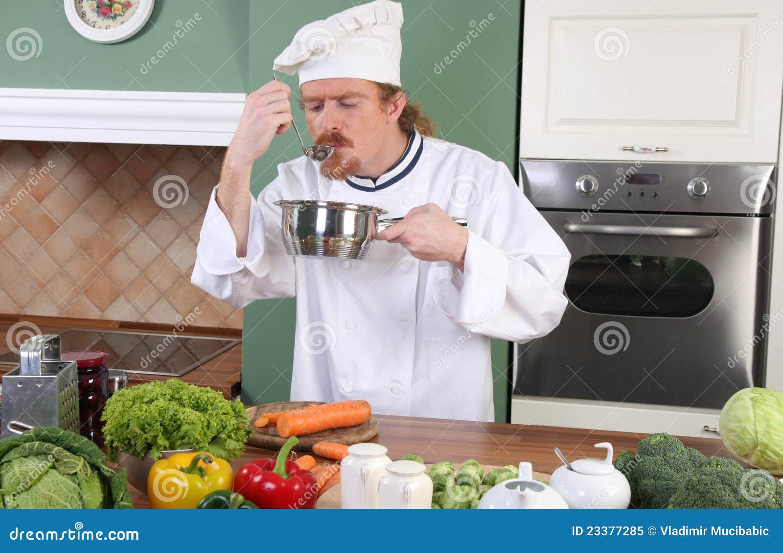 Young Chef tasting food stock image. Image of dinner 23377285