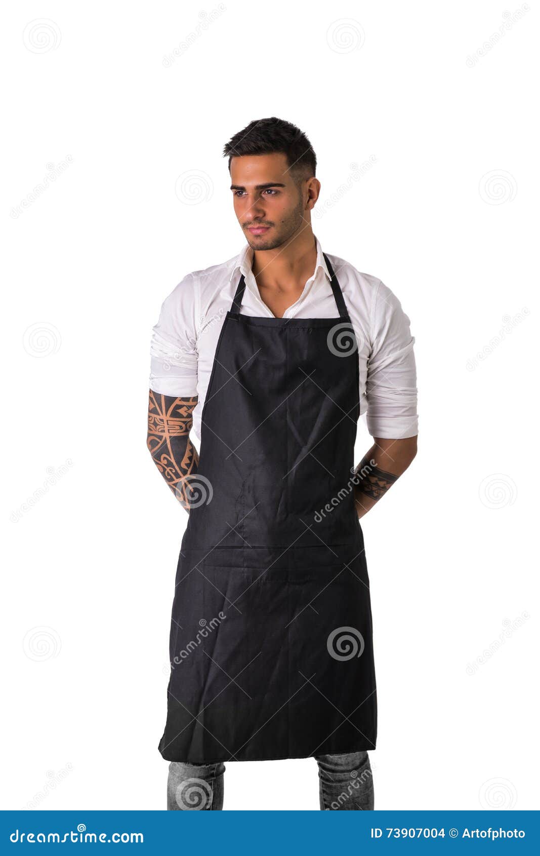 young chef or waiter wearing black apron