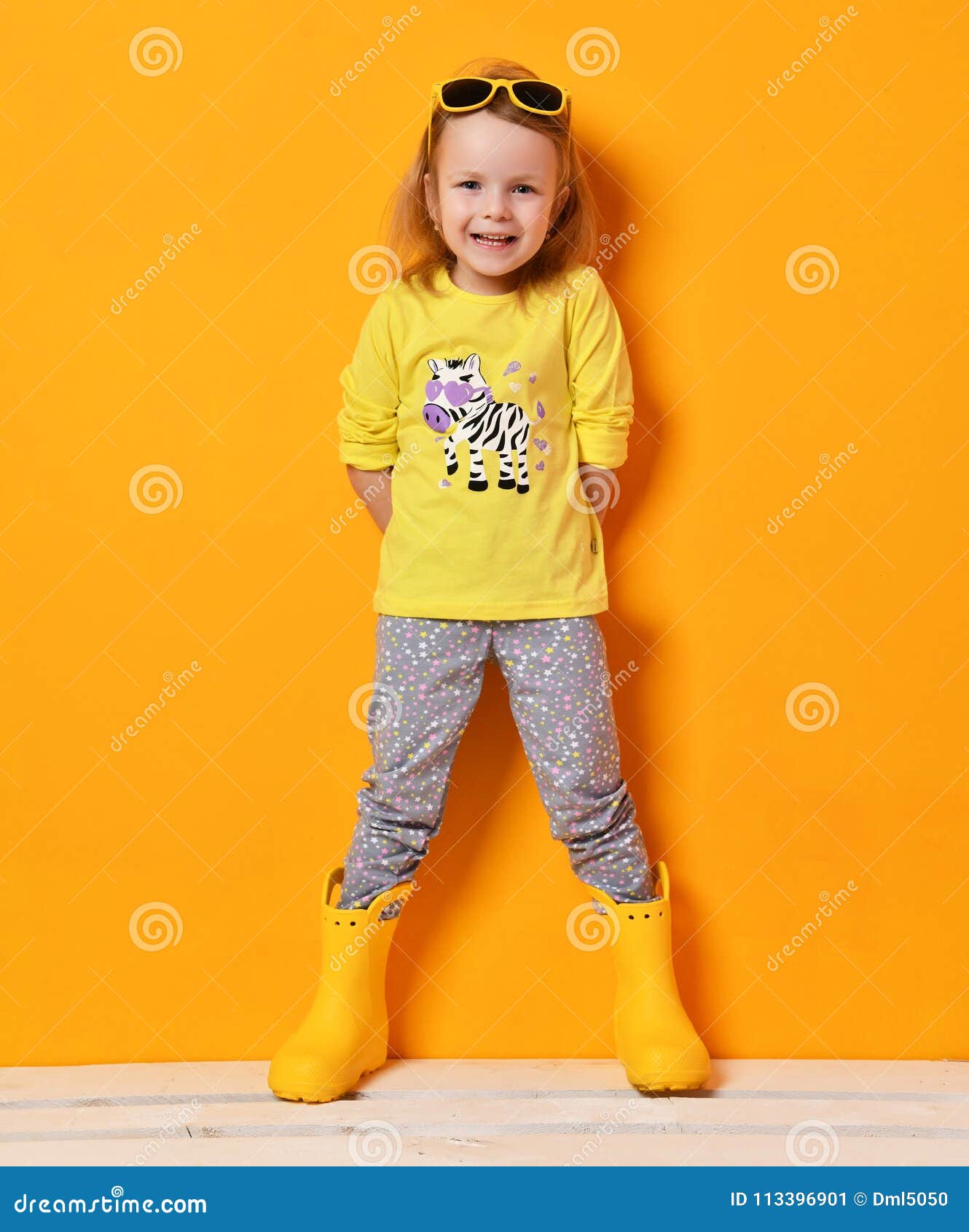 Young Child Baby Girl Kid in Yellow Rubber Boots Sunglasses and T-shirt ...