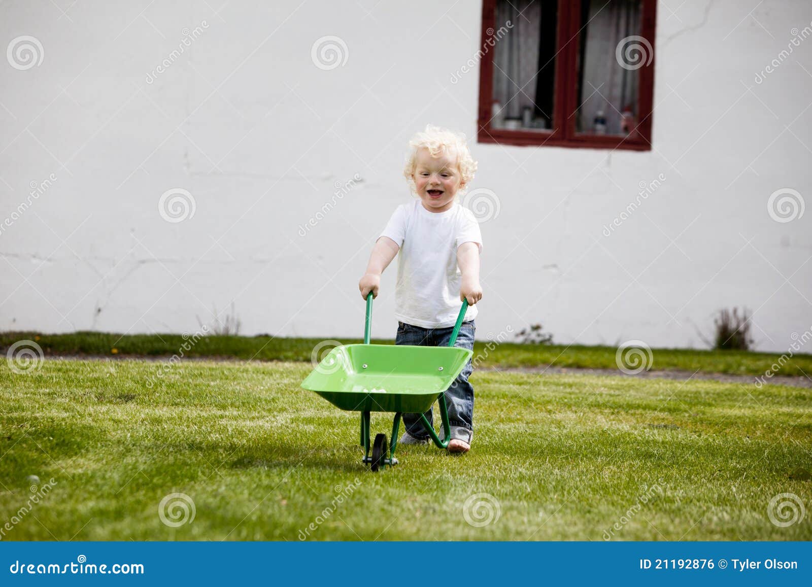 Young Child Pushing Wheelbarrow Stock Photo Image 21192876