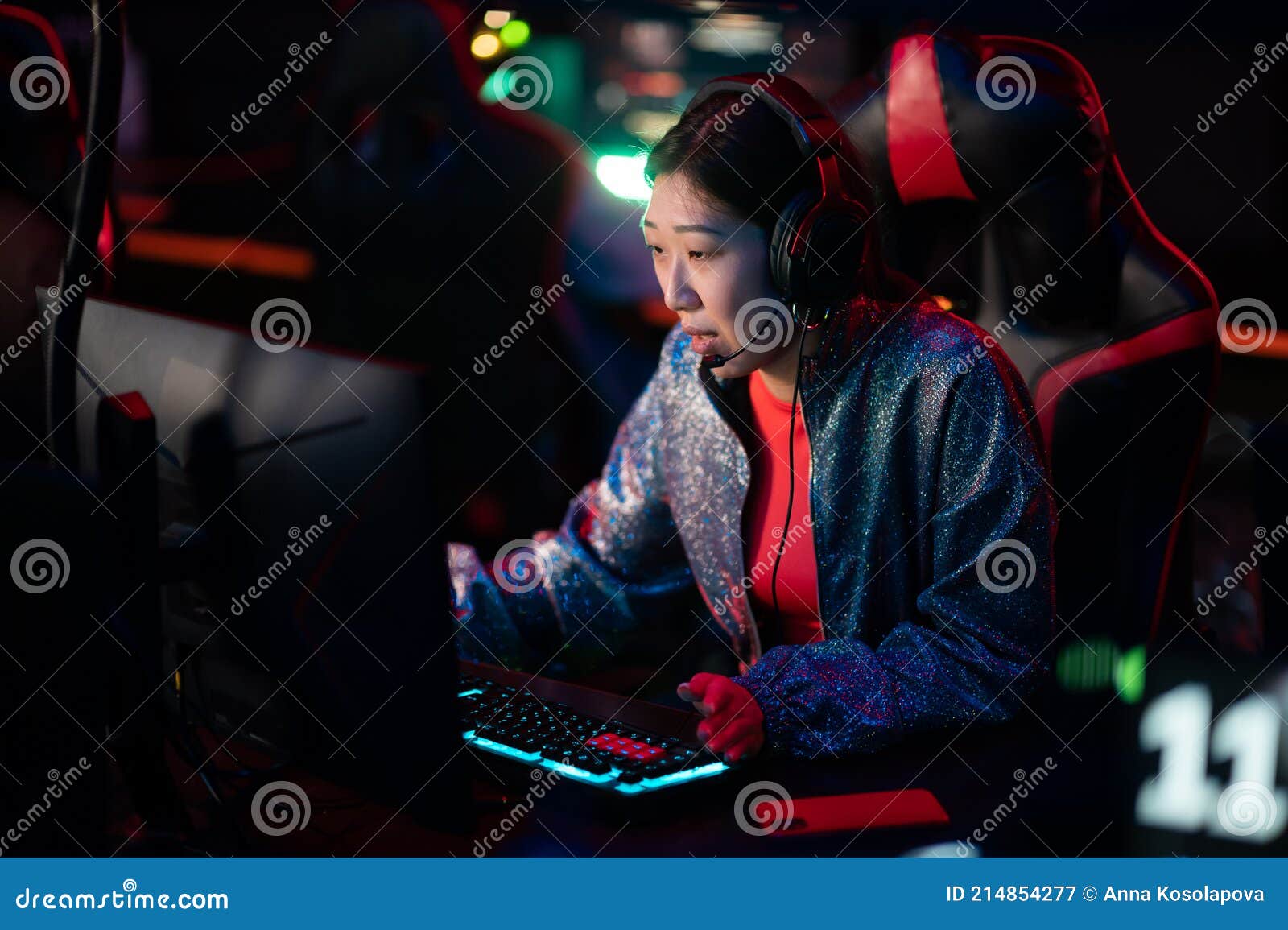 Pro Player Gamer Young Asian Woman Playing Online Video Game Shooting Fps  Tournament Ranking Cyber Internet At Night Red Neon Light Room With Gaming  Headset And Keyboard On Championship Event Stock Photo 