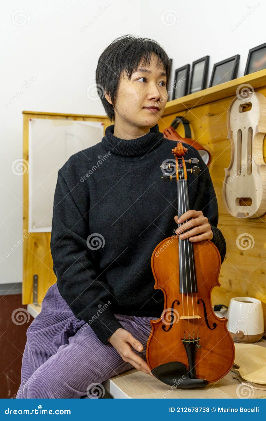 Young Chinese Violin Maker at Work in Her Stock Photo Image