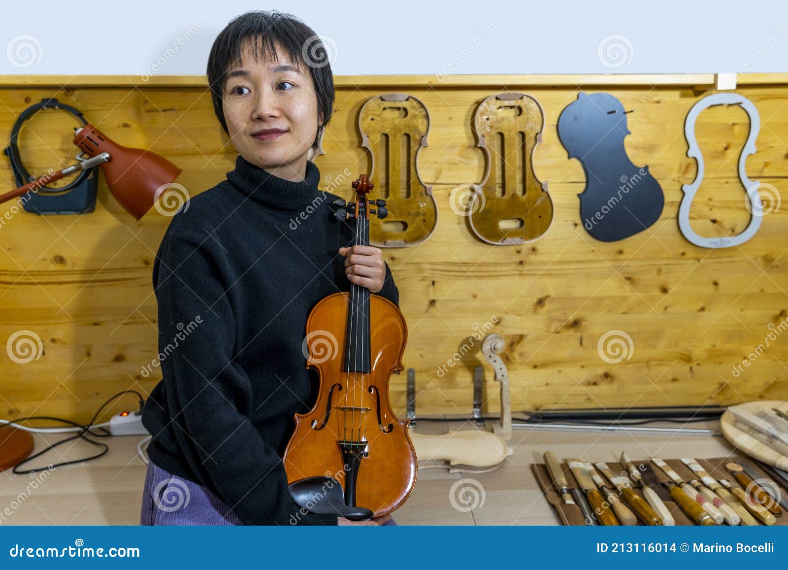 Young Chinese Violin Maker at Work in Her Stock Photo Image