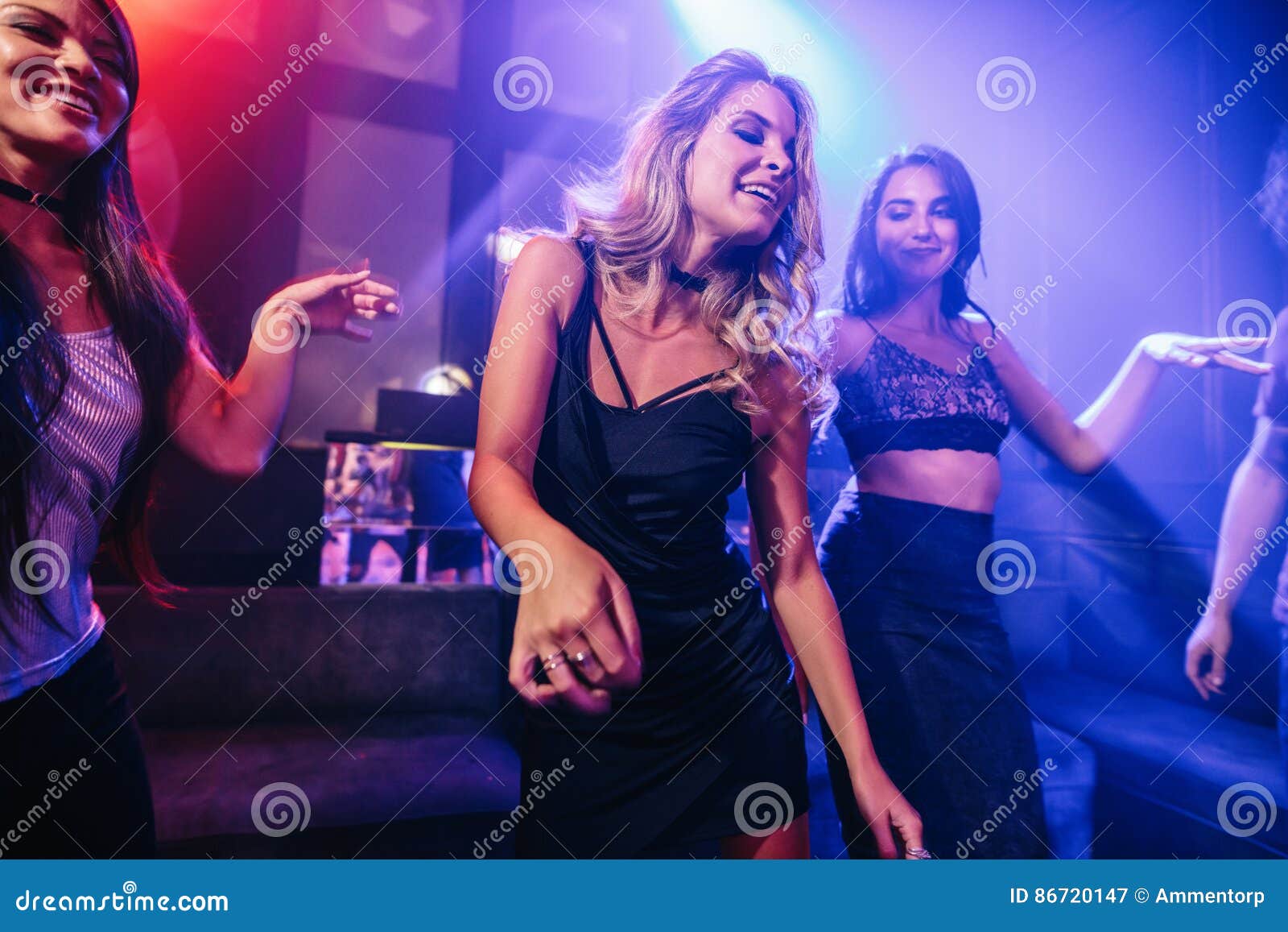 Young Clubber Dancing Surrounded by Her Friends Stock Image - Image of ...