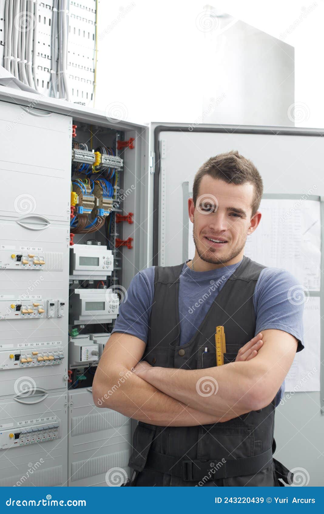 Electrical Work Poses No Problem for Him. Young Contractor Standing