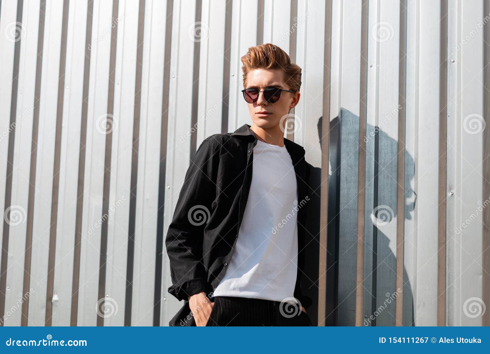 Young Cool Hipster Man with a Trendy Hairstyle in Elegant Clothes in Fashionable Dark Sunglasses Poses Near a Silver Metal Wall Stock Image - Image of hairstyle, nice: 154111267 Young Cool Hipster Man with a Trendy Hairstyle in Elegant Clothes in Fashionable Dark Sunglasses Poses Near a Silver Metal Wall Stock Image - Image of hairstyle, nice: 154111267