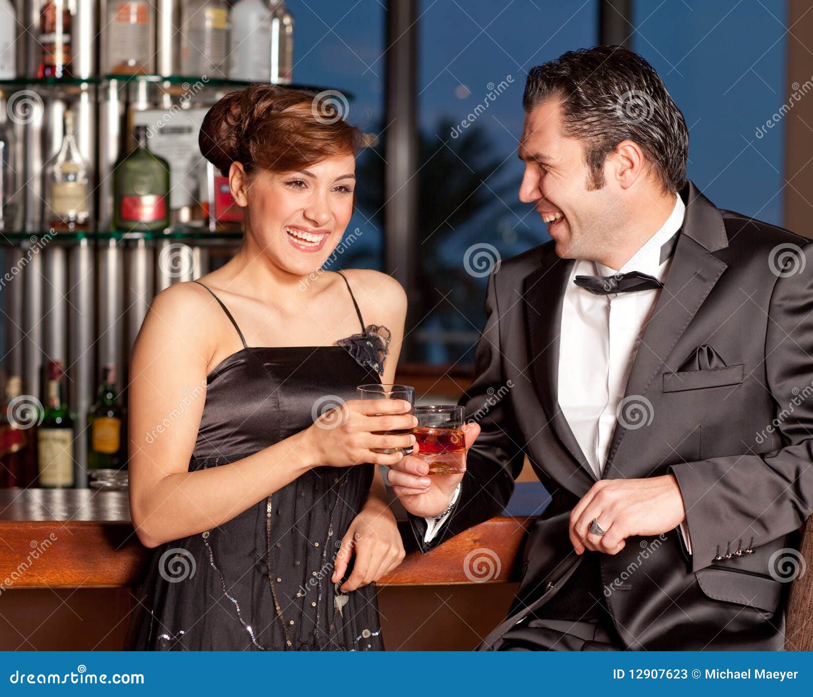 Young Couple At Bar Drinking And Flirting Stock Photos Image 12907623