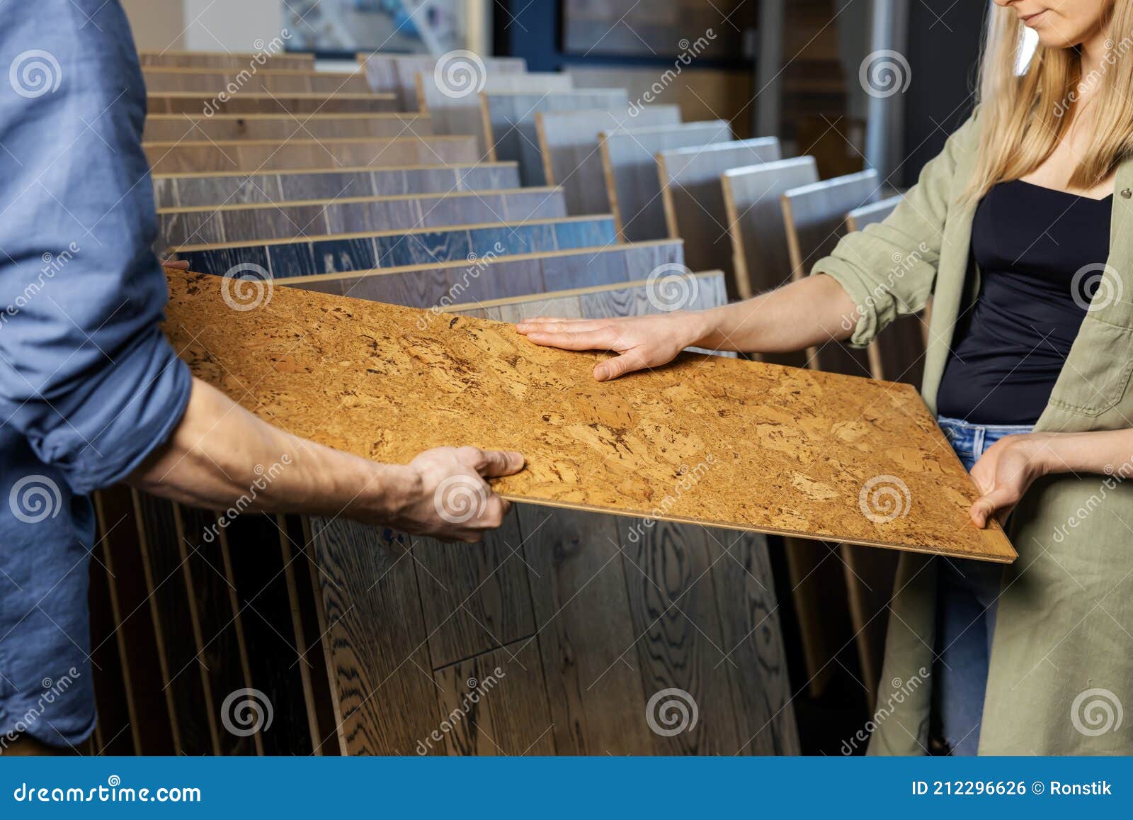 couple choosing cork floor for home improvements in flooring shop