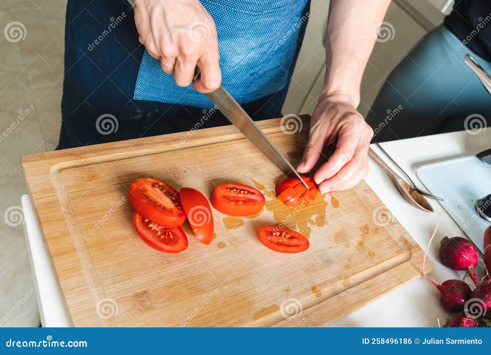 person chopping vegetables, to make a salad and getting food ready to cook
