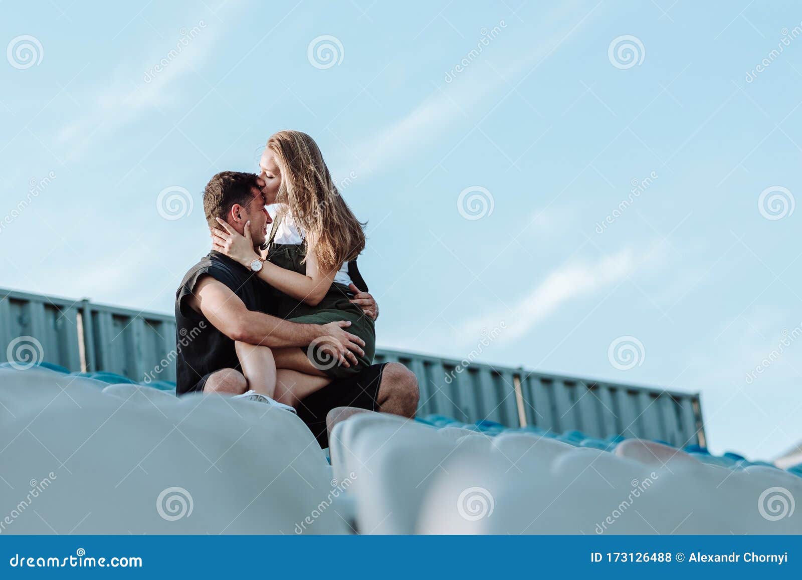 Girl Sitting On Boy Lap