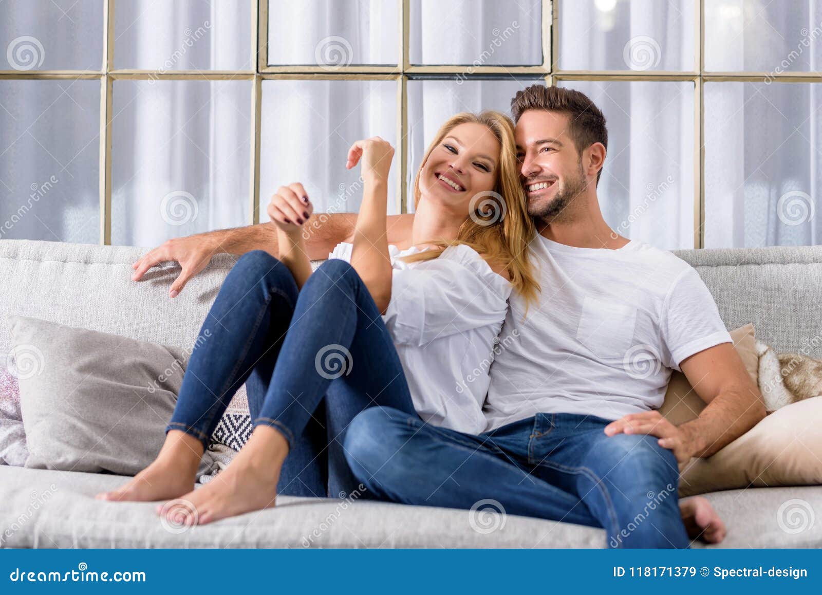Young Couple Cuddling On The Sofa Stock Image Image Of Passion Couch