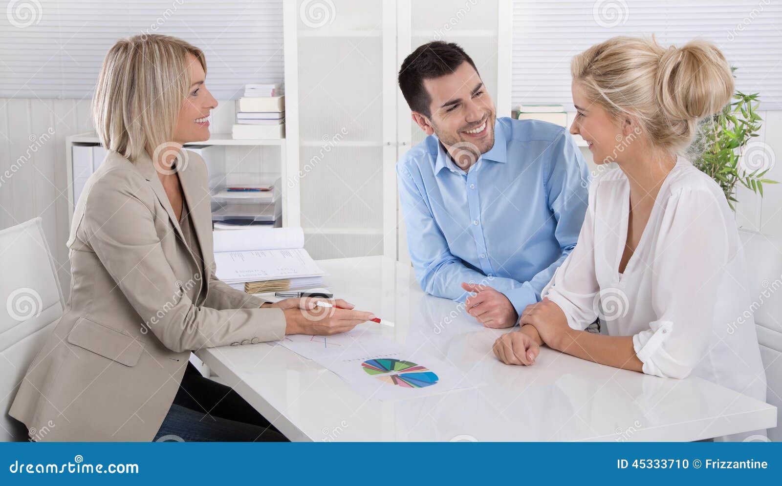 young couple in a date with a banker or adviser for retirement a