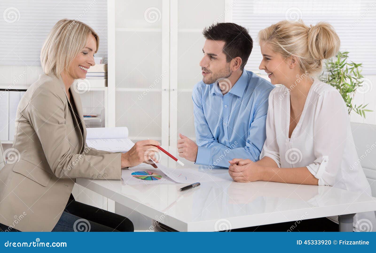 young couple in a date with a banker or adviser for retirement a