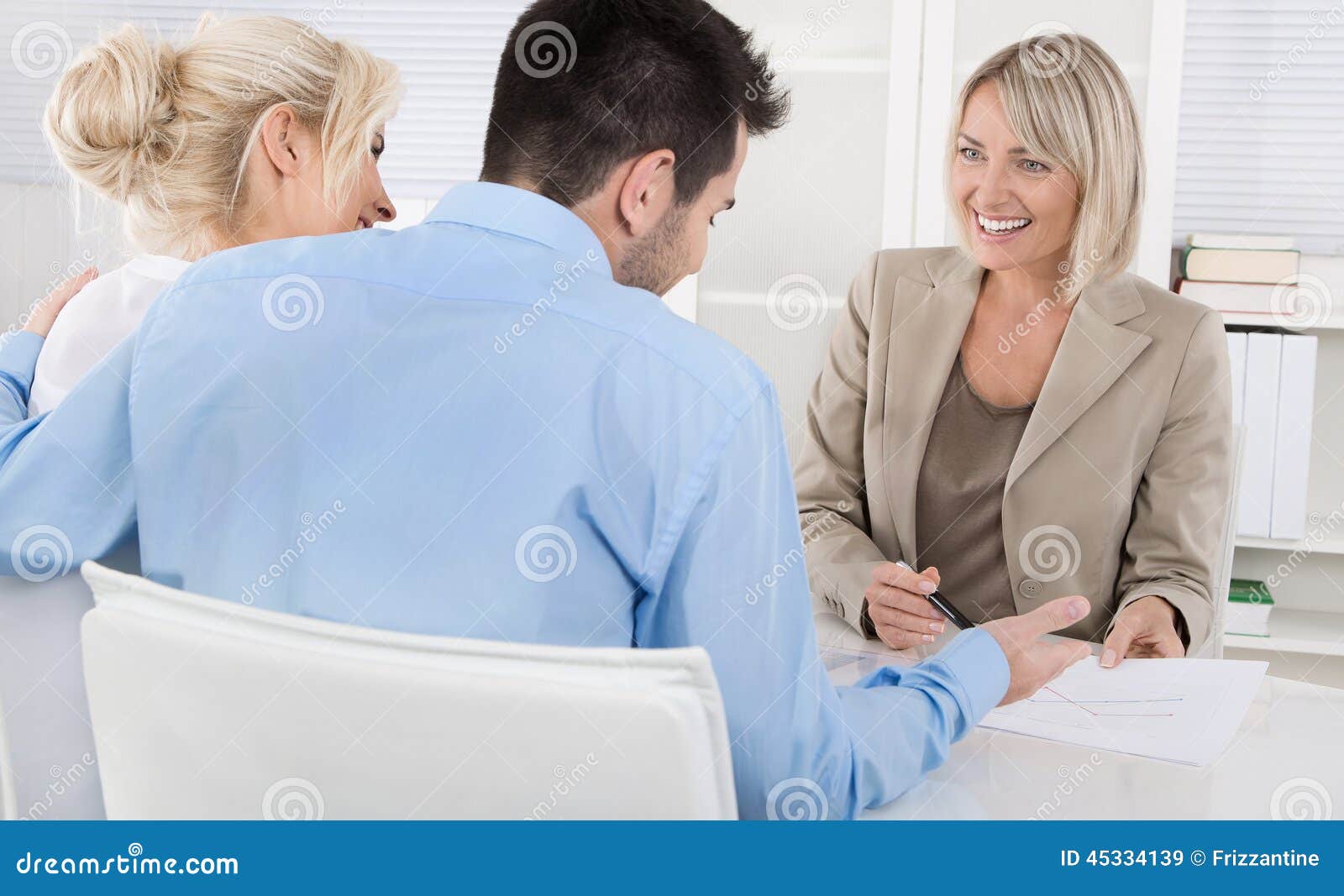 young couple in a date with a banker or adviser for retirement a