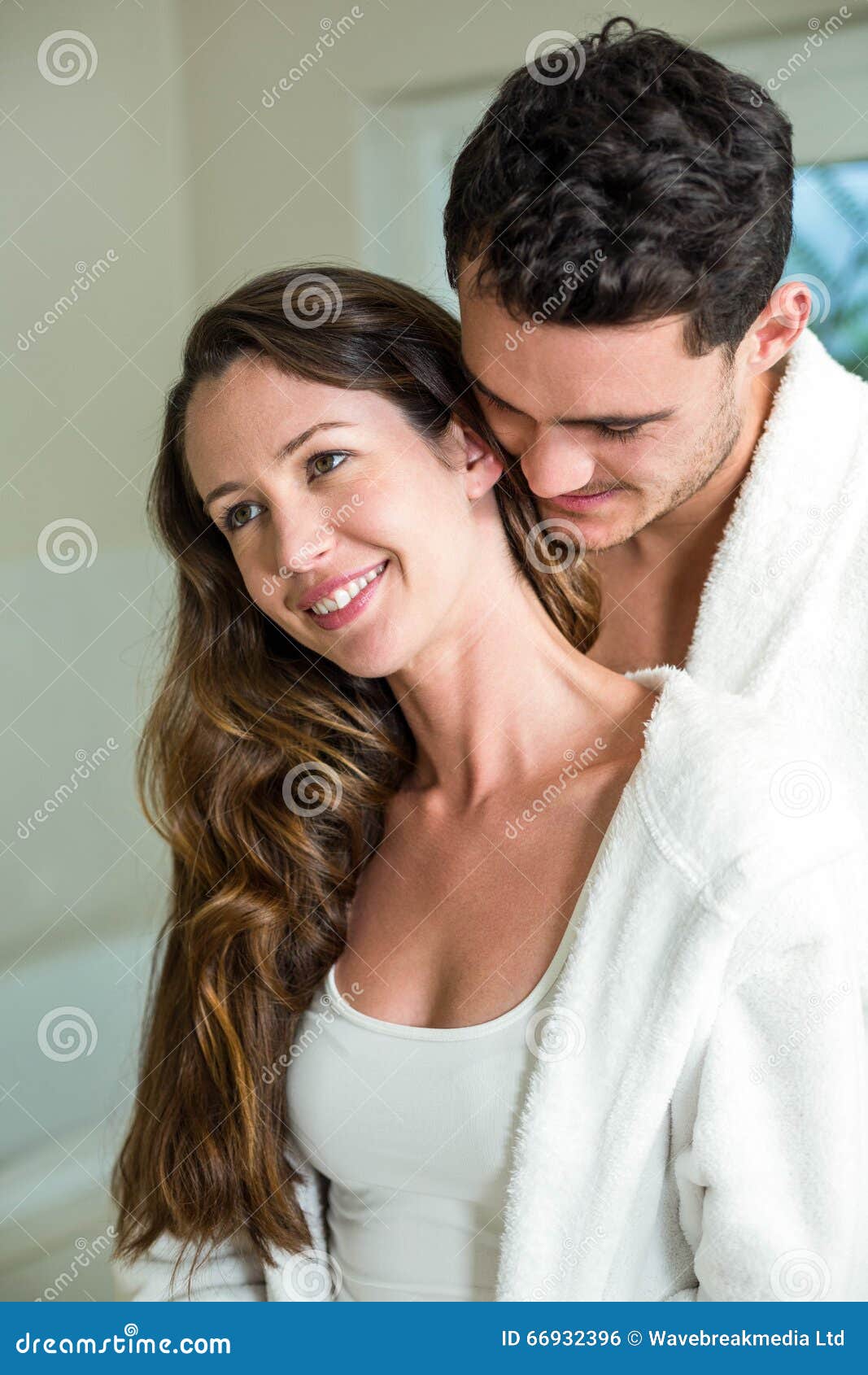 Young Couple Embracing In B