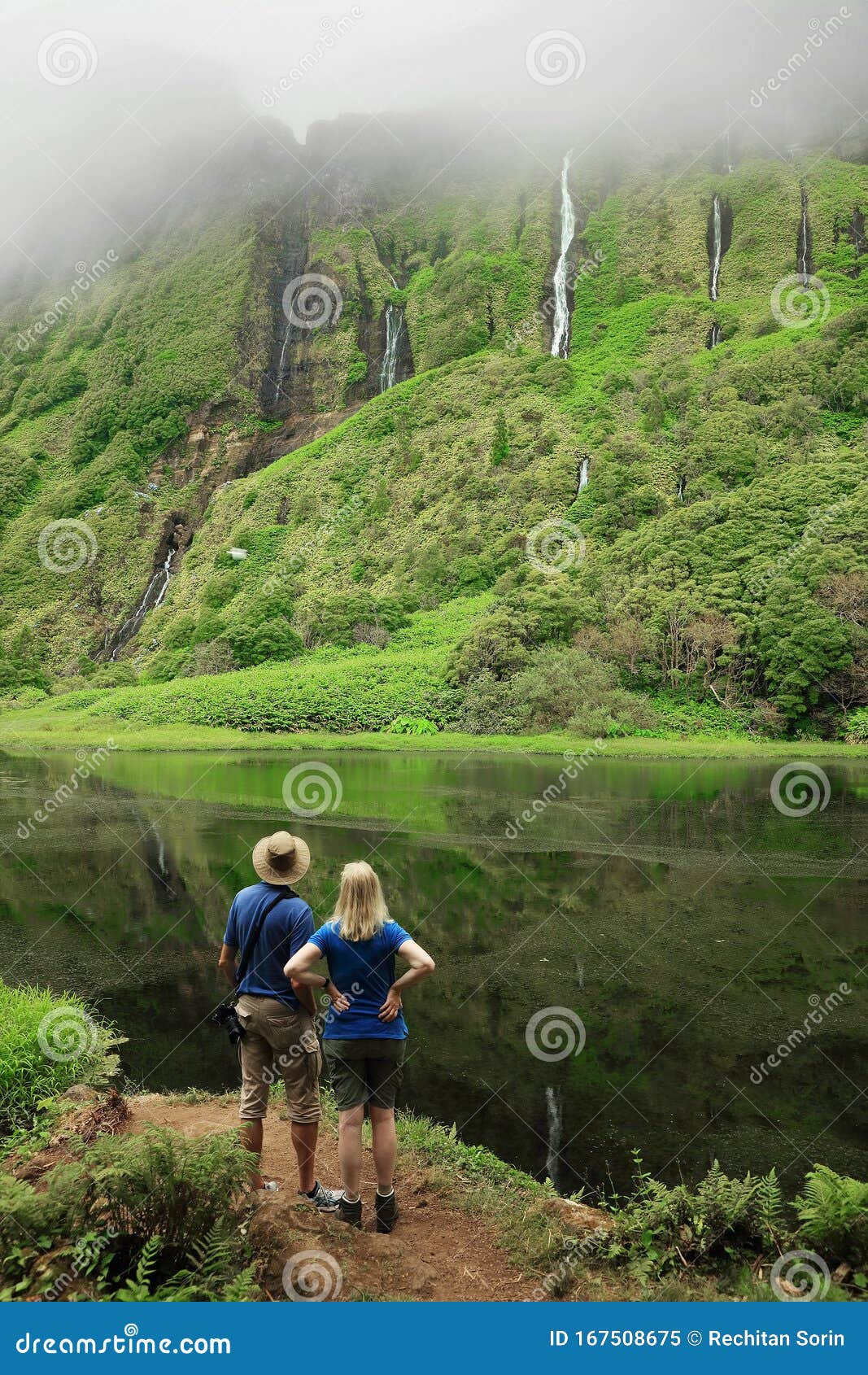 young couple enjoying the landscape of the waterfall in pozo da alagoinha.