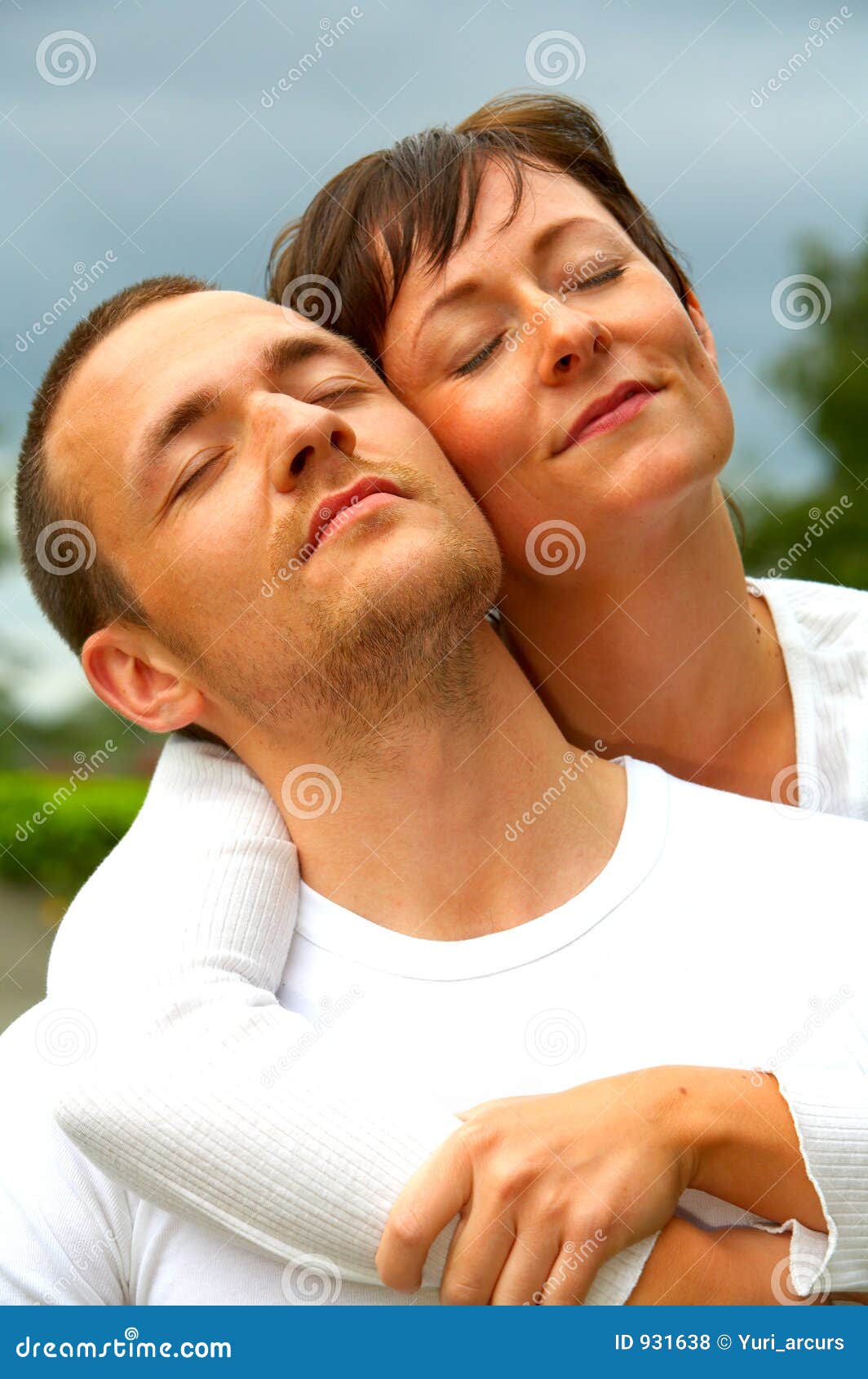 A young couple enjoying the spring sun. The concept is: Summer love, romance and a happy lifestyle.