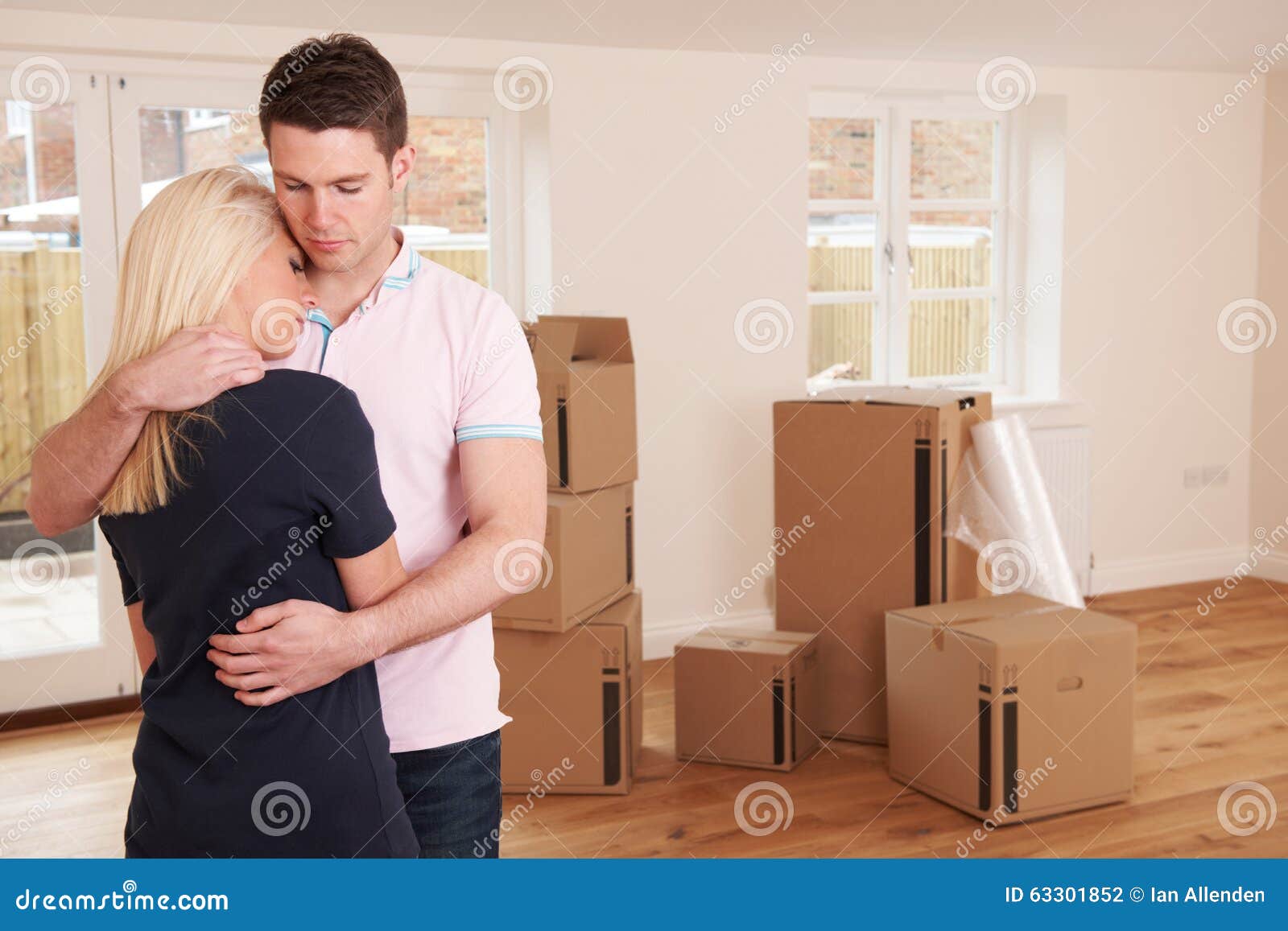 Young Couple Forced To Sell Home through Financial Problems Stock Photo
