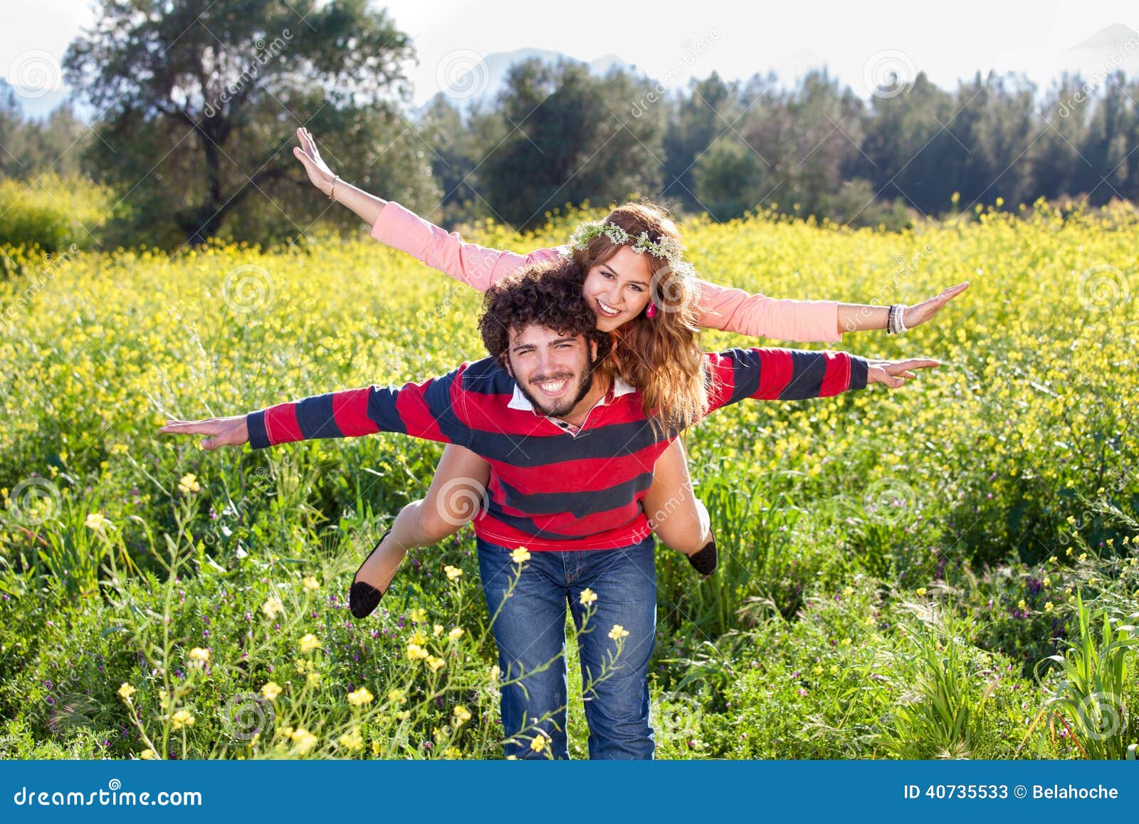 Young Couple Frolicking in the Countryside. Stock Image - Image of