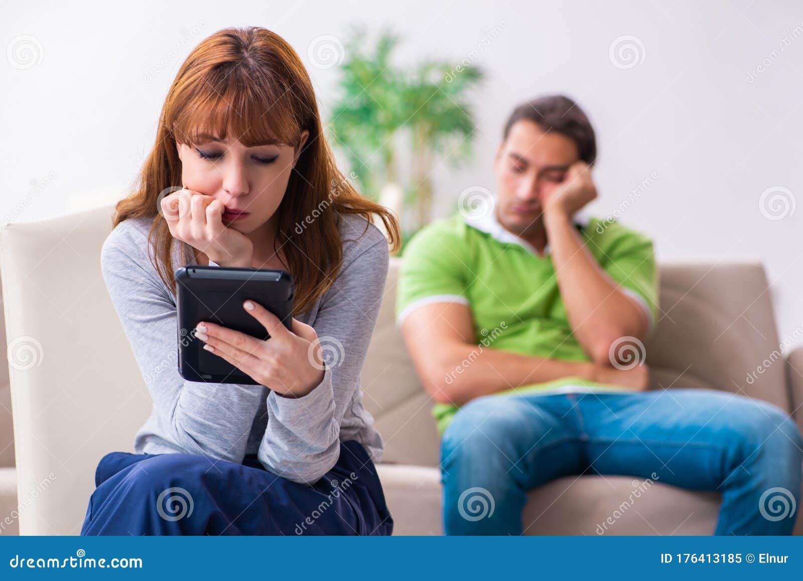 Young Couple in Gadget Dependency Concept Stoc