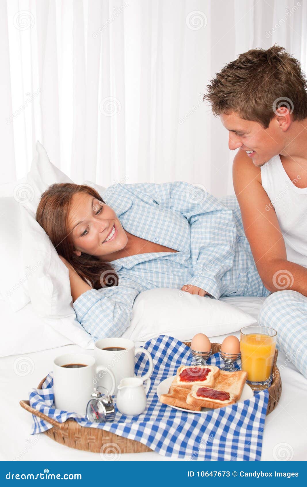 Young Couple Having Breakfast in Bed Stock Image Image of lounge, female 10647673