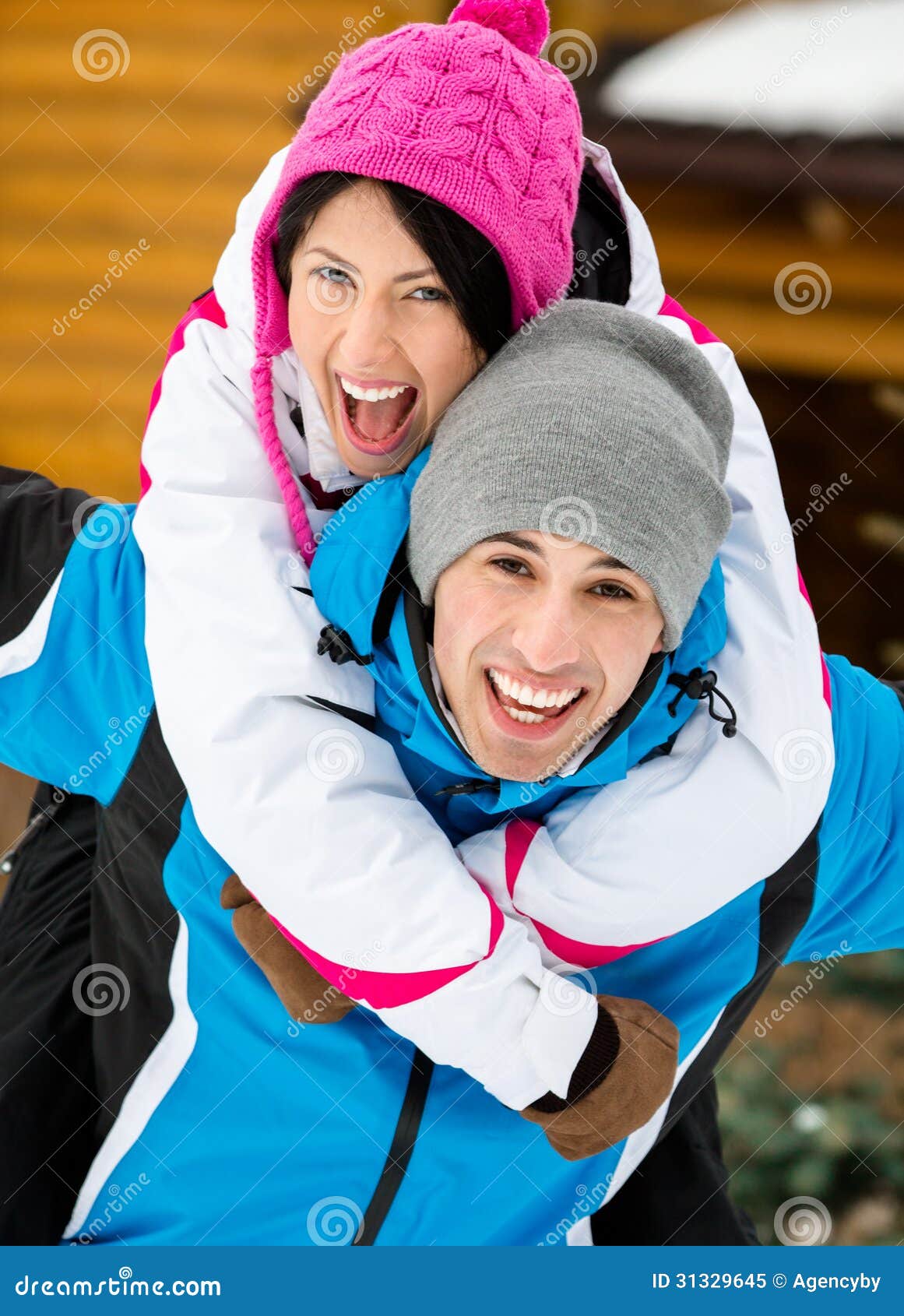 Young Couple Having Fun During Winter Vacations Stock