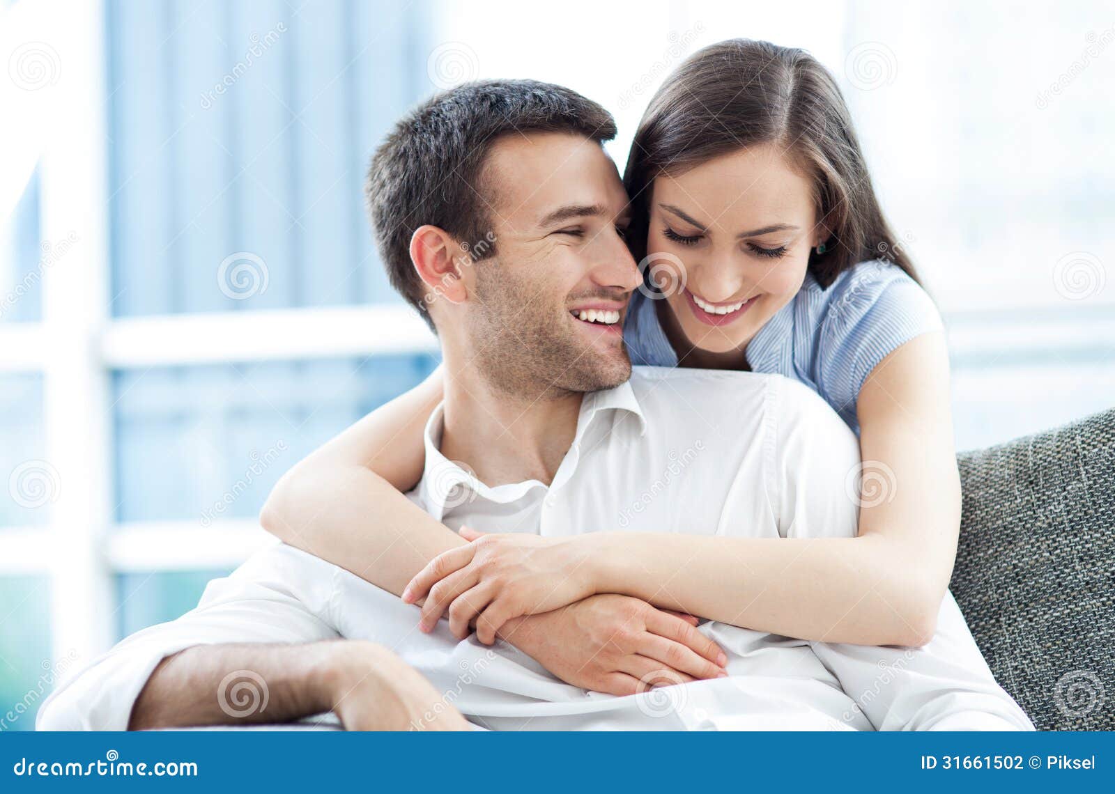 young couple hugging portrait smiling 31661502