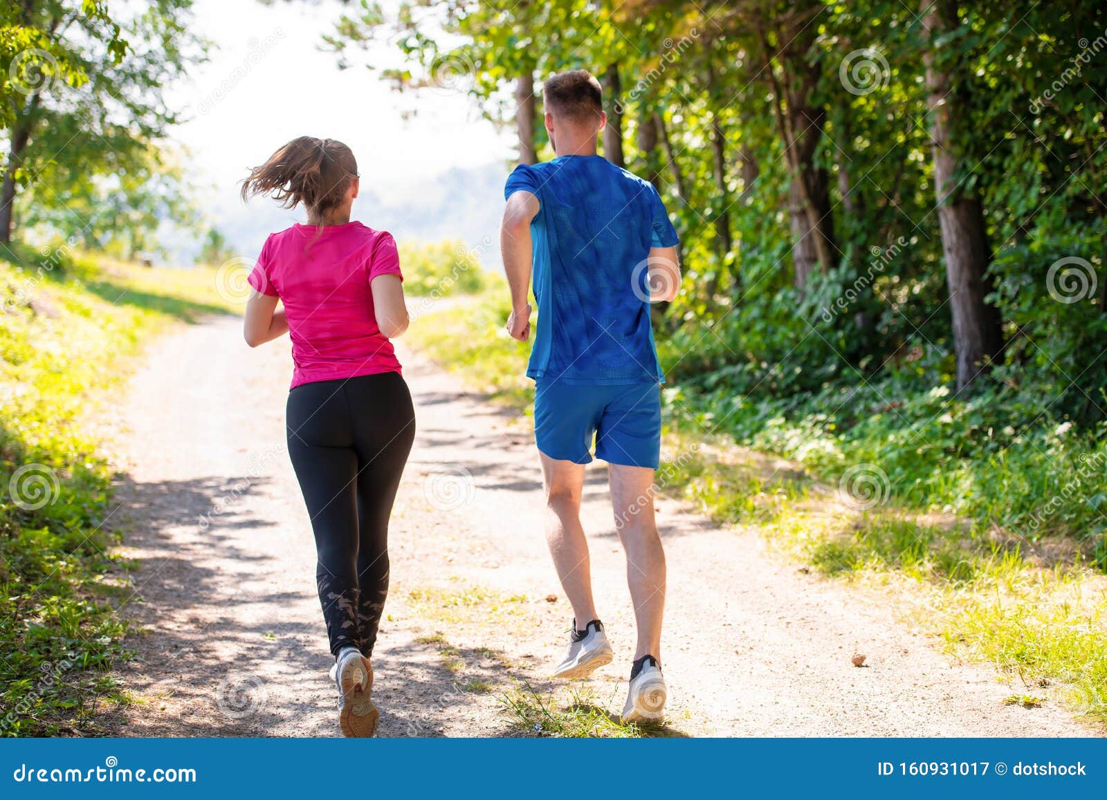 Young Couple Jogging On Sunny Day At Nature Stock Image Image Of