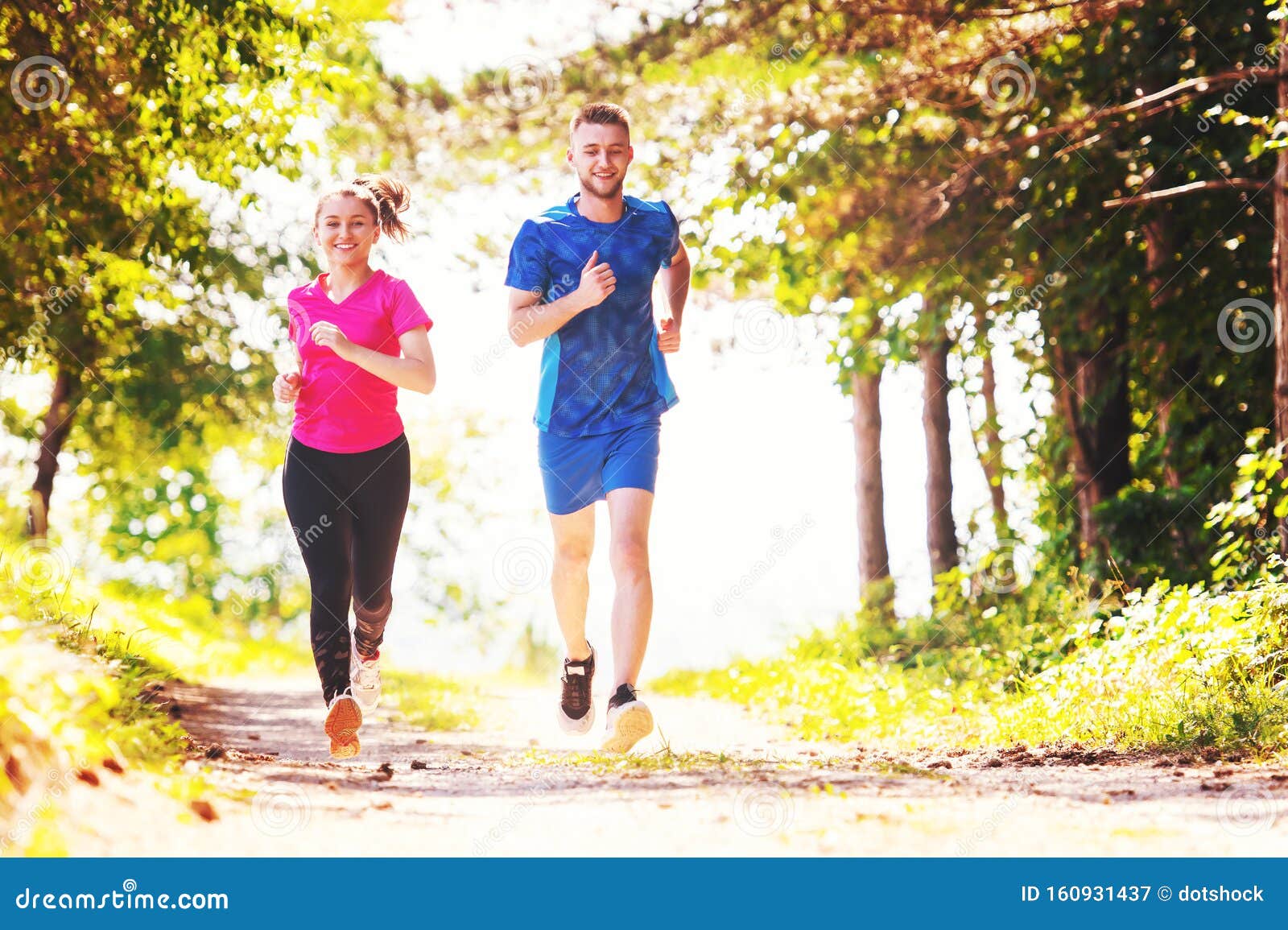 Young Couple Jogging On Sunny Day At Nature Stock Image Image Of Park
