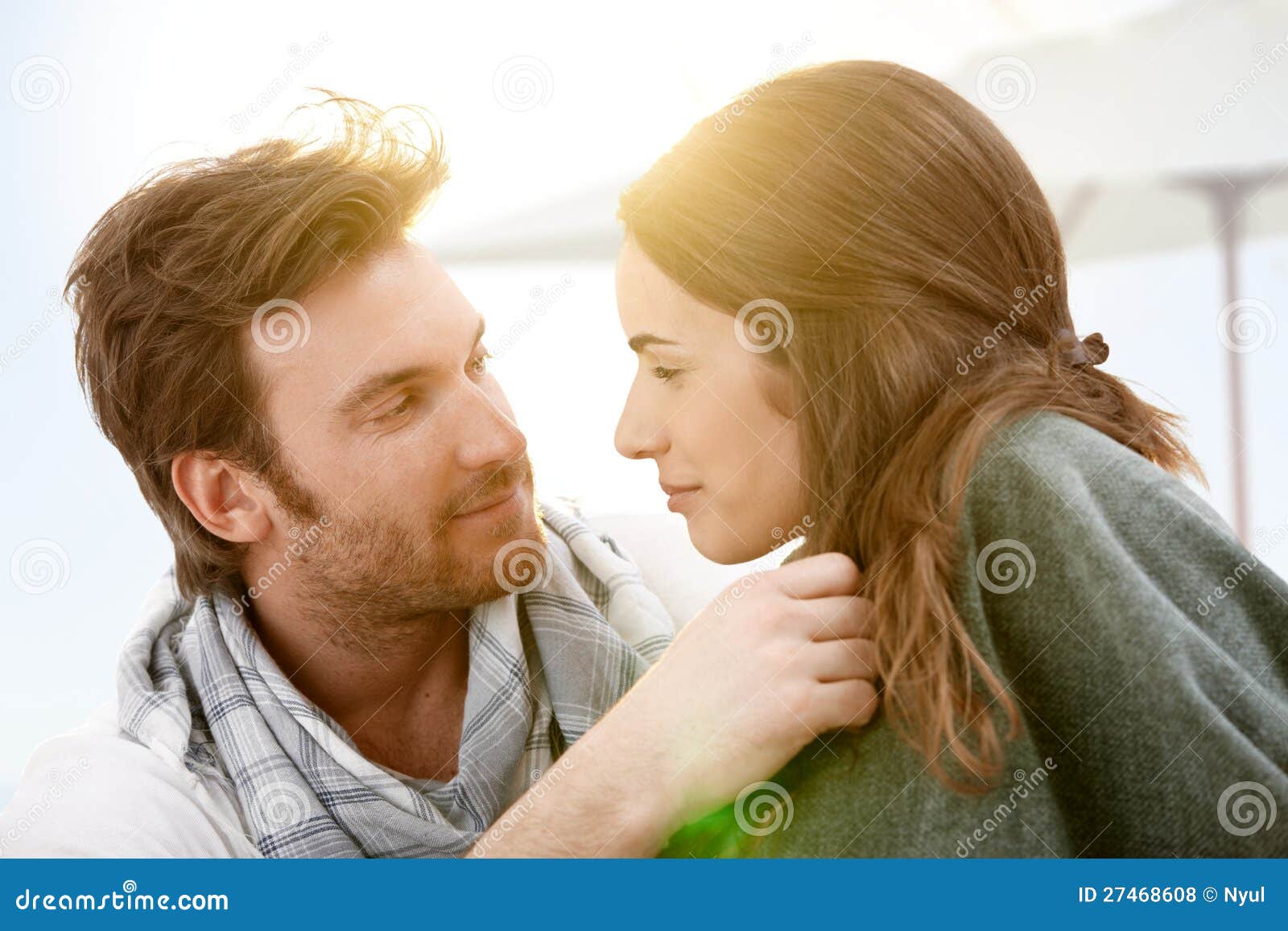 Young Couple Kissing in Summer Sunshine on Beach Stock Photo - Image of ...