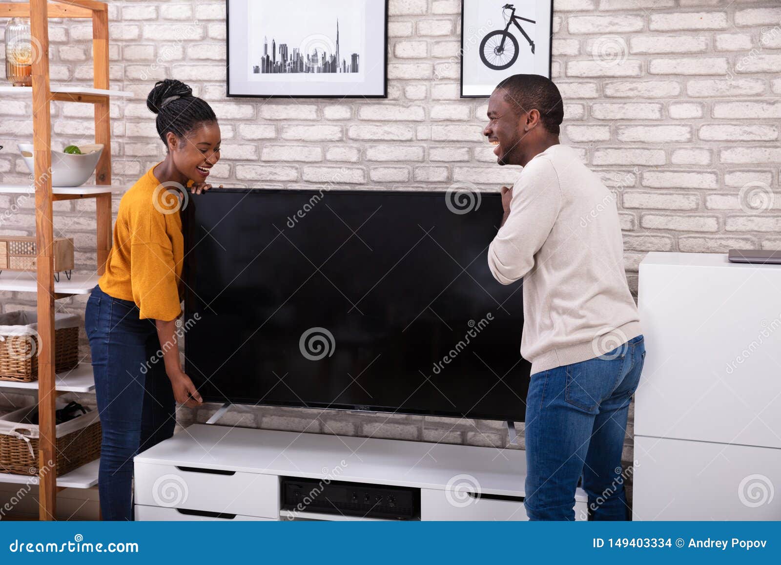Young Couple Lifting Television Stock Photo Image of furniture, male