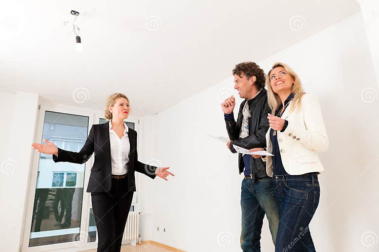 Young Couple Looking For Real Estate With Female Realtor Stock Image Image Of Broker Buying 