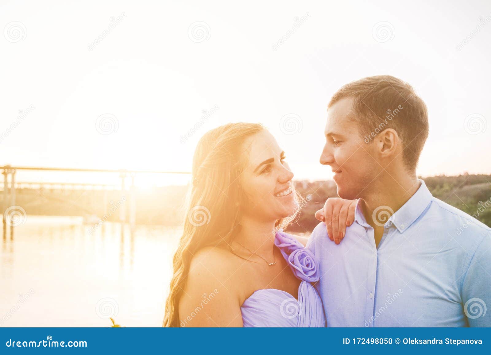 https://thumbs.dreamstime.com/z/young-couple-love-hug-each-other-two-lovers-people-sunset-river-beautiful-woman-man-standing-rock-women-men-172498050.jpg