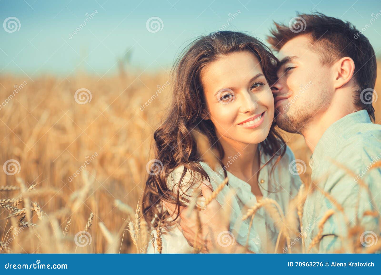 Young Couple Poses Cheek To Cheek Completing A Whole Stock Photo - Download  Image Now - iStock
