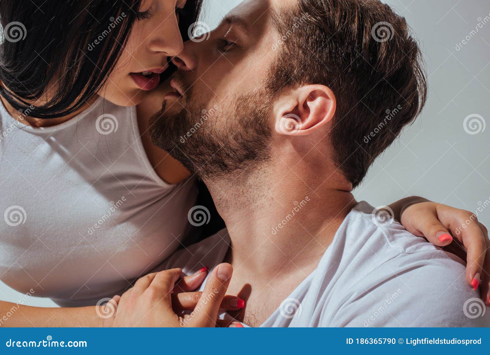 young couple in love trying to kiss each other