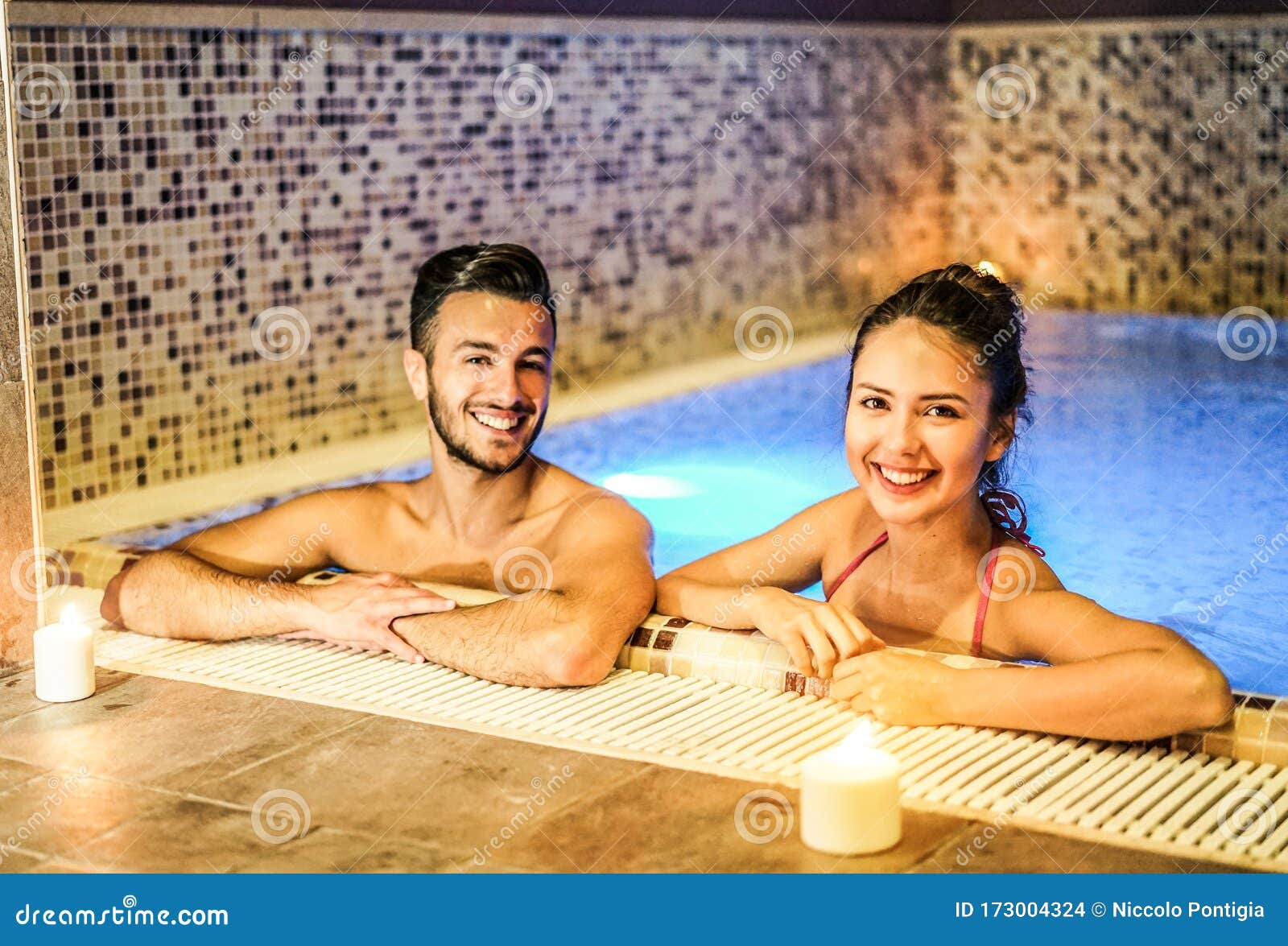 Young Couple Of Lovers Enjoying Spa Swimming Pool Romantic L