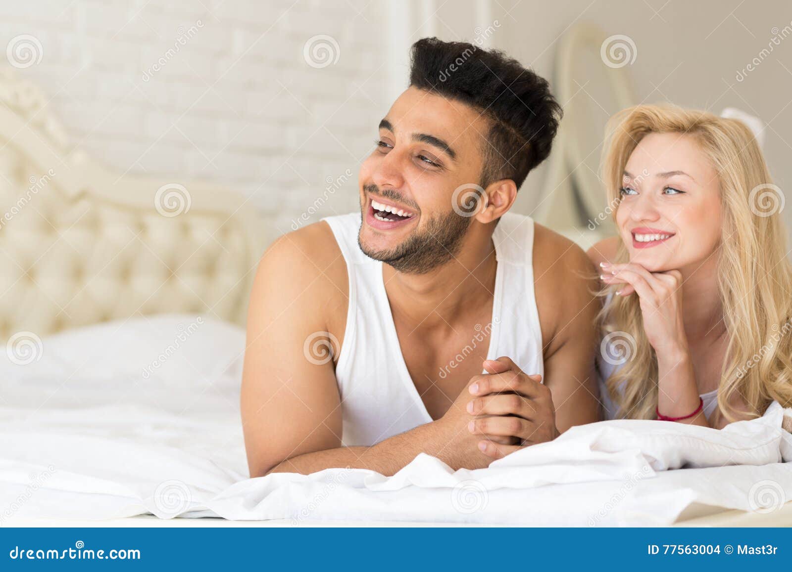 Young Couple Lying In Bed Happy Smile Hispanic Man And Woman