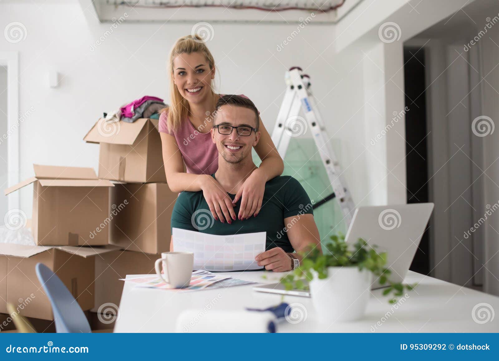 Young Couple Moving In A New Home Stock Photo Image Of Casual Estate