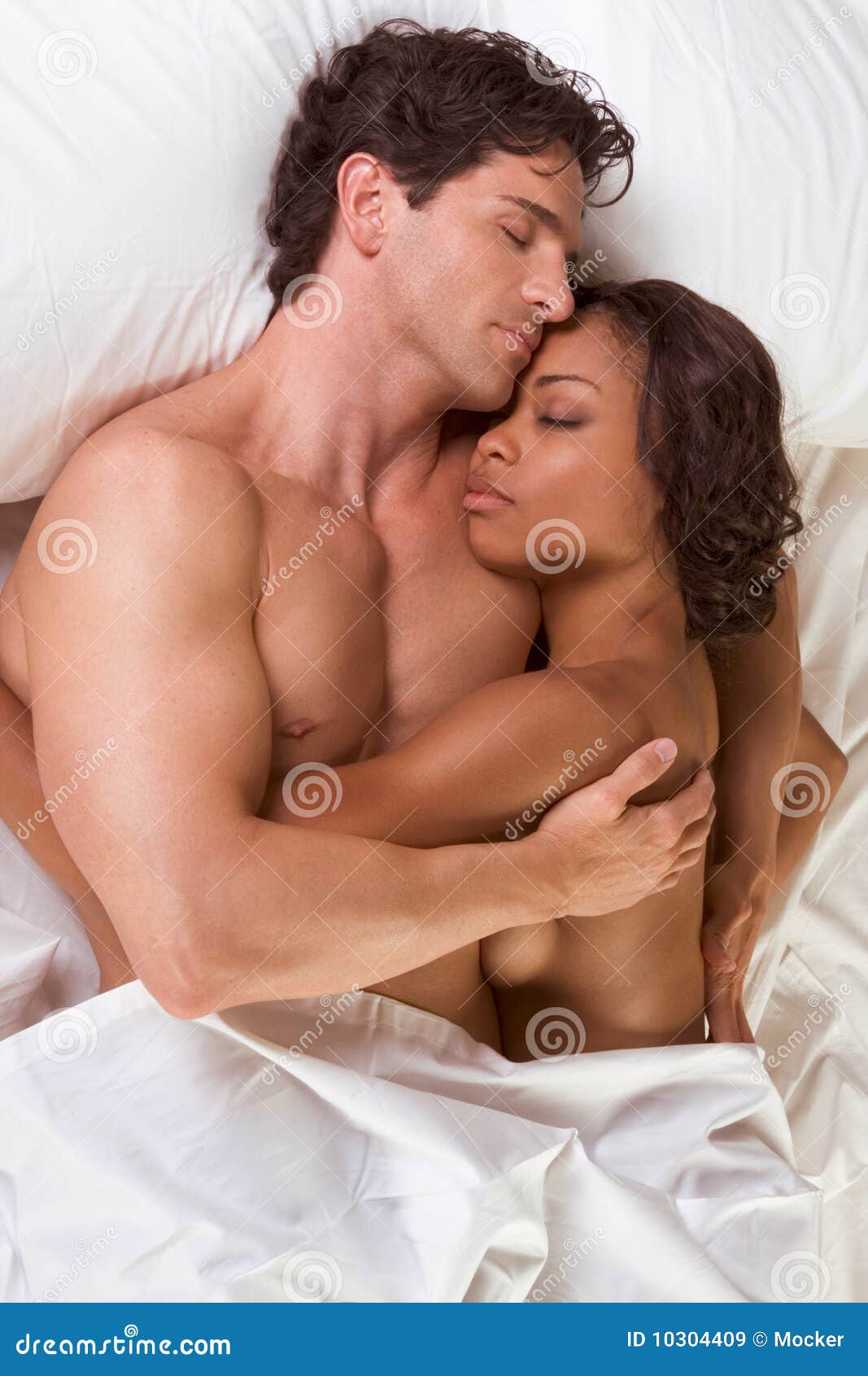 Young Couple Naked Man and Woman Sleeping in Bed Stock Image
