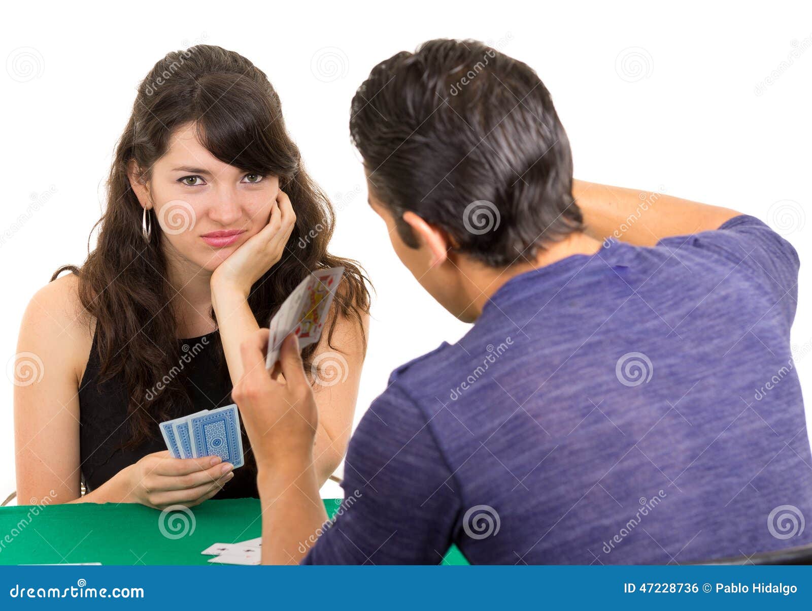 young couple playing cards cuarenta