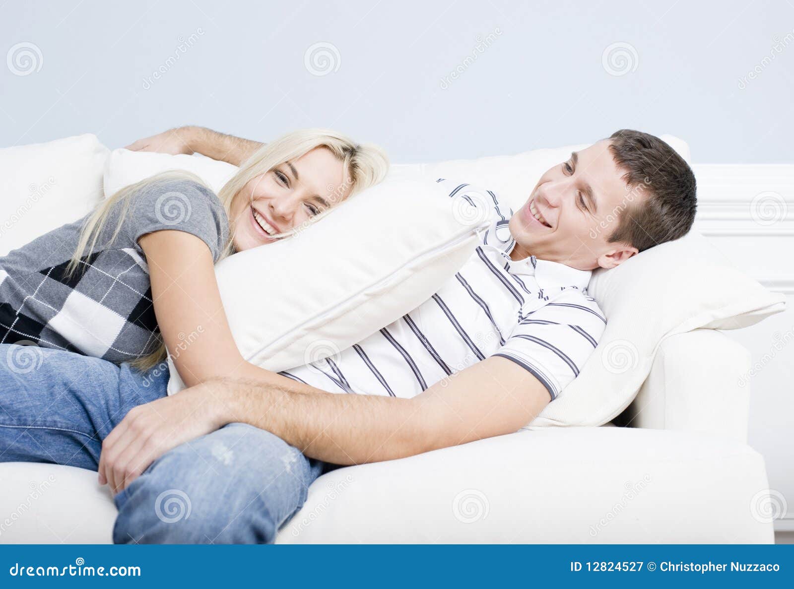Young Couple Reclining on Sofa Stock Image Image of copy, people