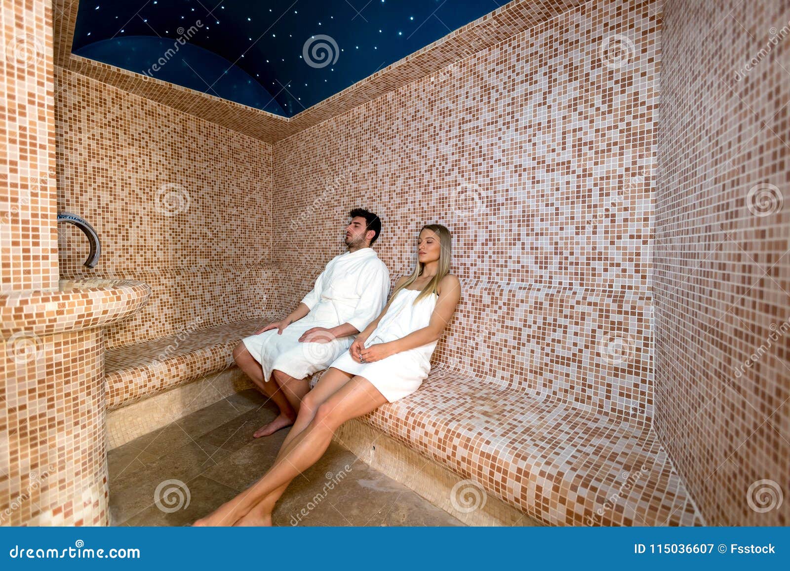 Young Couple Relaxing Inside Spa Sauna Turkish Bath - Two Lovers Enjoying Vacation in Luxury Resort Hotel Stock Image