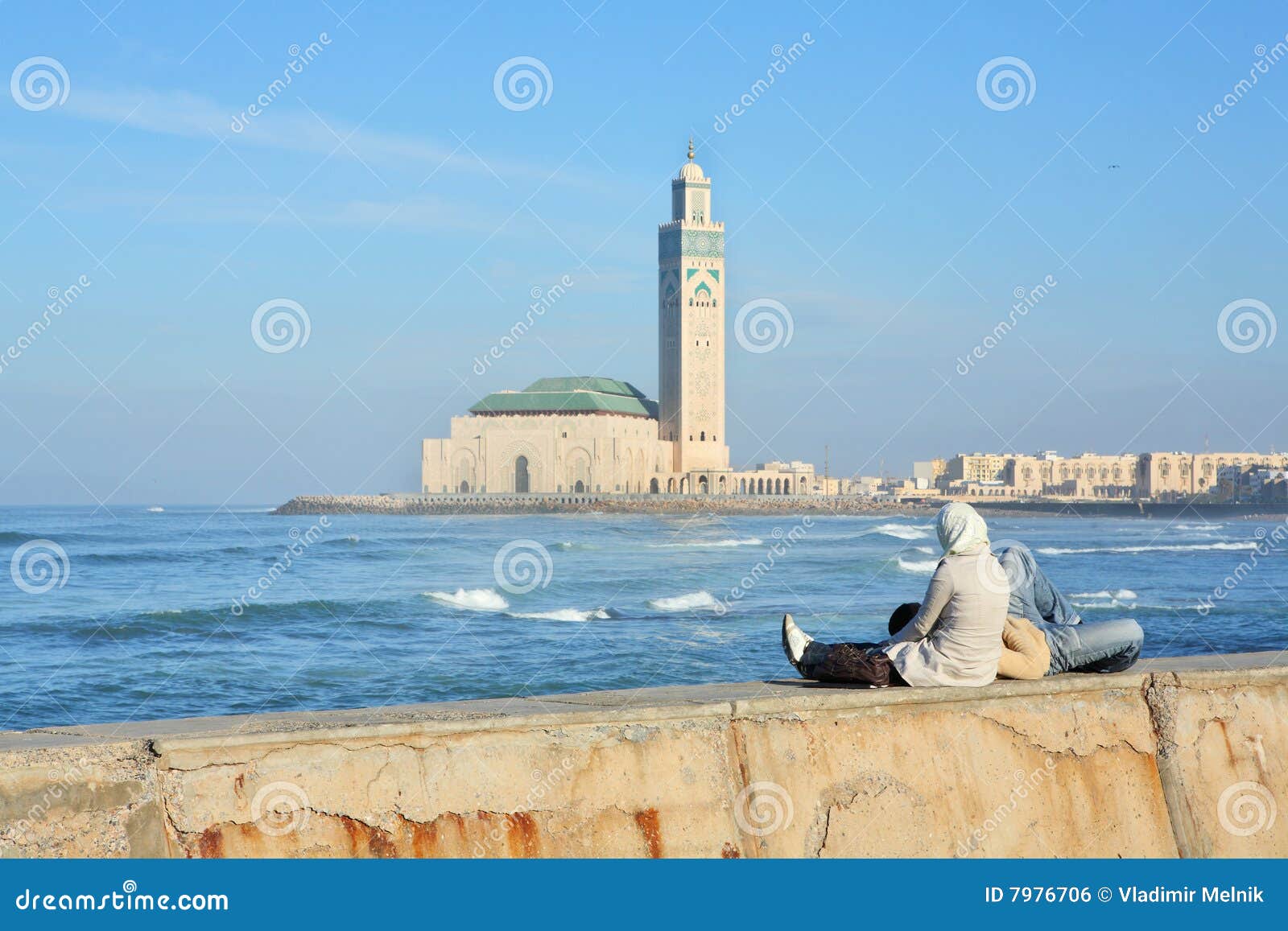 young couple relaxing on seafront