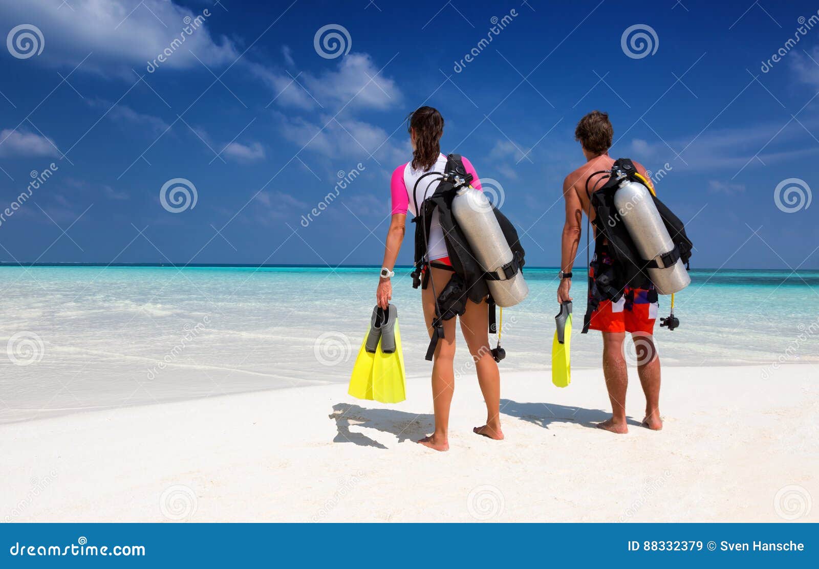 young couple in scuba diving gear
