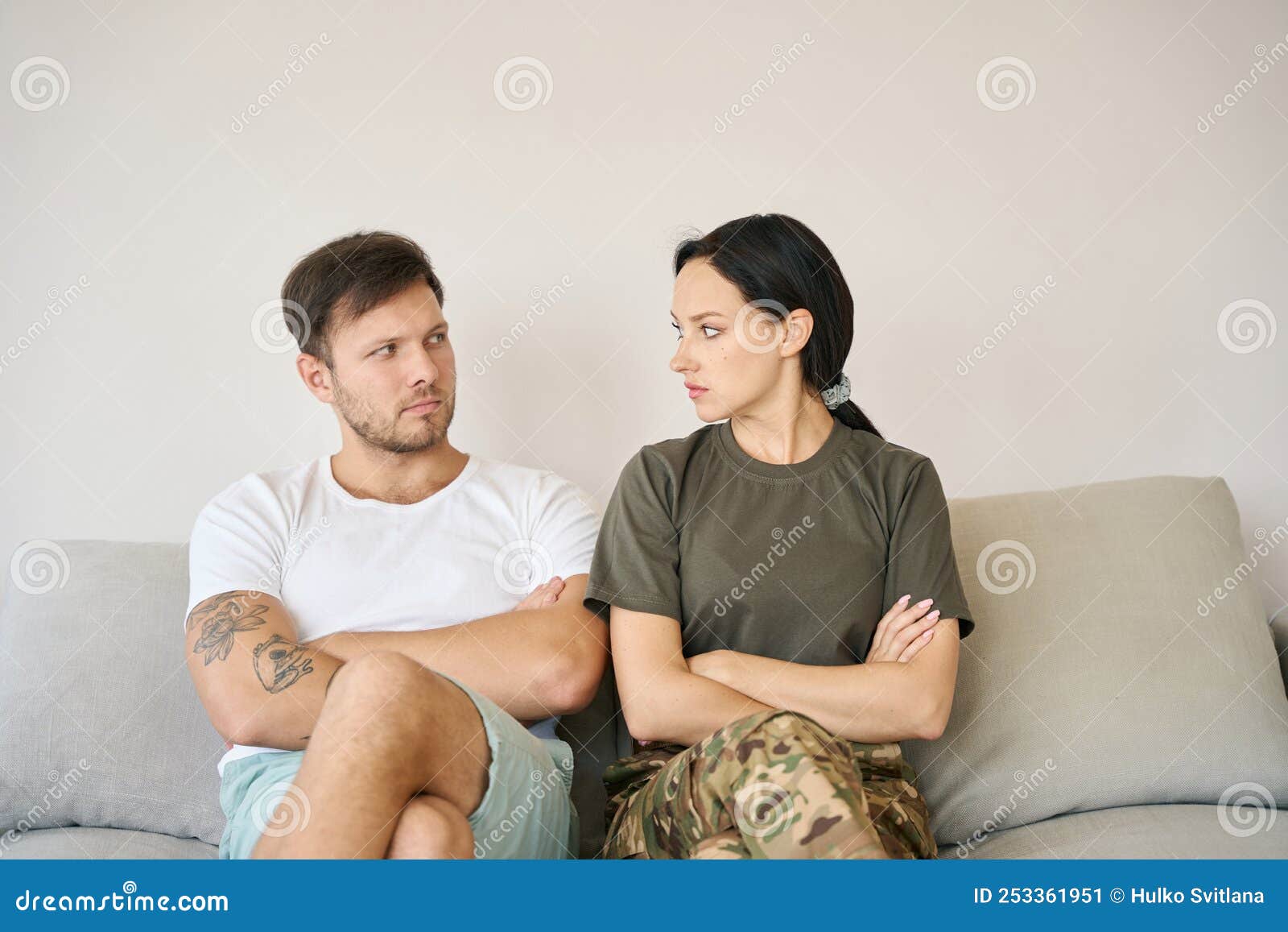 Happy affectionate couple sitting in hanging chair at home - a Royalty Free  Stock Photo from Photocase